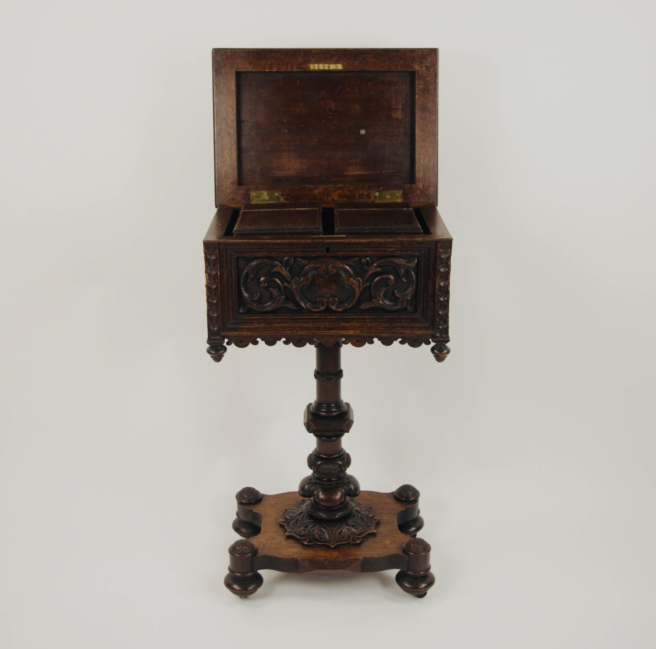 A late 19th century Flemish oak teapoy, carved all over with Renaissance style decoration. Turned column with quadripartite base.

This item is on view in Berkshire - UK.