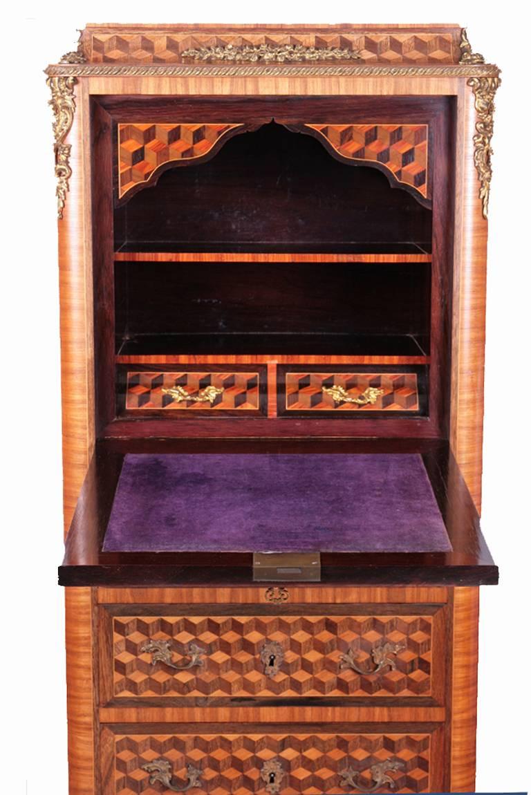 Secretaire de dame a abattant (drop leaf). This delightful piece comprises a secretaire fold down writing surface covered in velvet, revealing two small drawers and an alcove for letters and writing papers etc. The secretaire is veneered in various