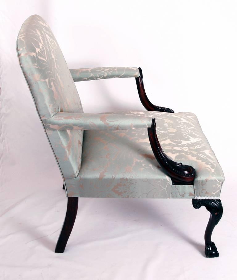 Mahogany Gainsborough armchair on carved cabriole legs with ball and claw feet. The chair has been newly upholstered in Eau de Nil damask.