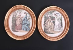 Pair of Printed and Hand Colored Fashion Plates in Antique Oval Gilt Frames