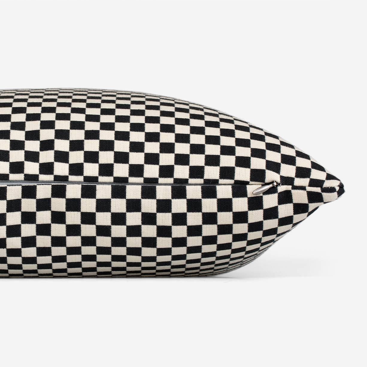 Maharam Pillow
Checker by Alexander Girard
008 Black/White

Designed by Alexander Girard for the Herman Miller textile division in 1965, checker is a simple checkerboard design offered in an array of colors. The double-weave construction allows the