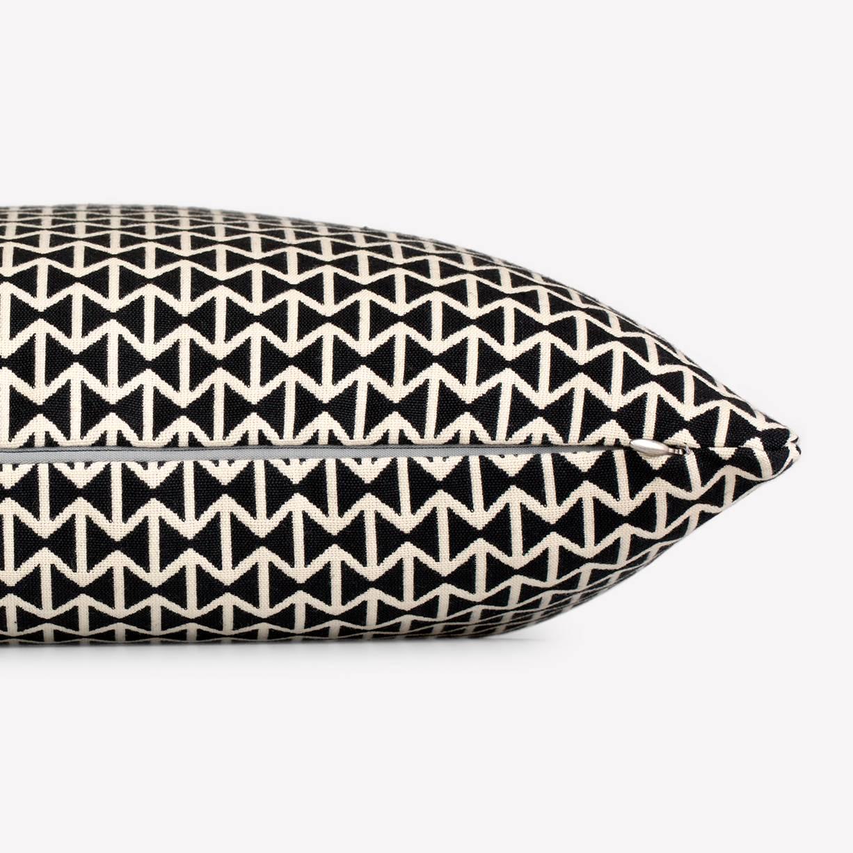 Maharam Pillow
Double Triangles by Alexander Girard 
001 Black/White

Designed by Alexander Girard in 1952 during his tenure as founding director of the Herman Miller Textile Division, Double Triangles features repeating ribbons of black and white
