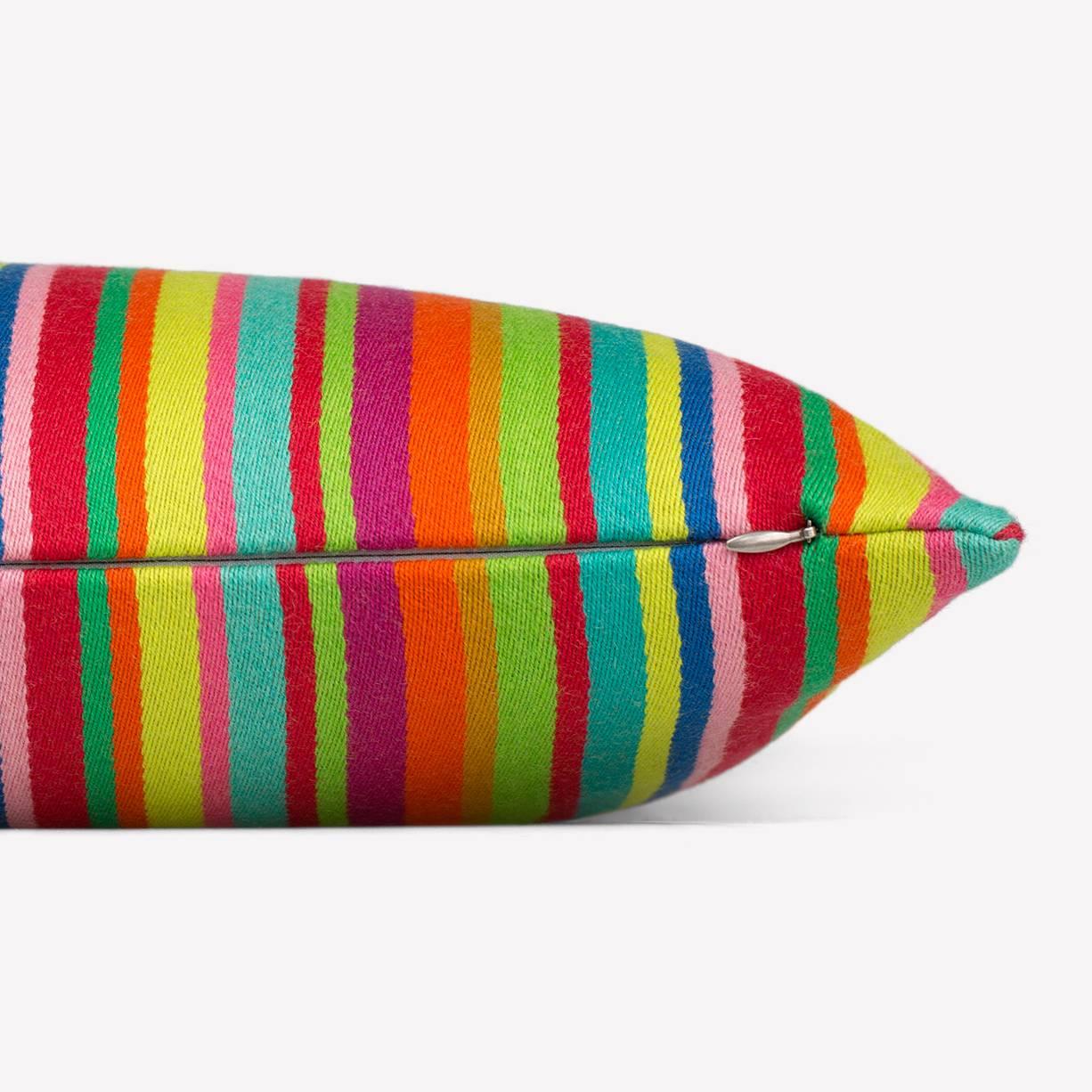 Maharam Pillow
Millerstripe by Alexander Girard 
001 Multicolored

Girard drew inspiration from his travels to Mexico and India, as well as from his fascination with traditional folk art. First designed for the Herman Miller Textile Division in