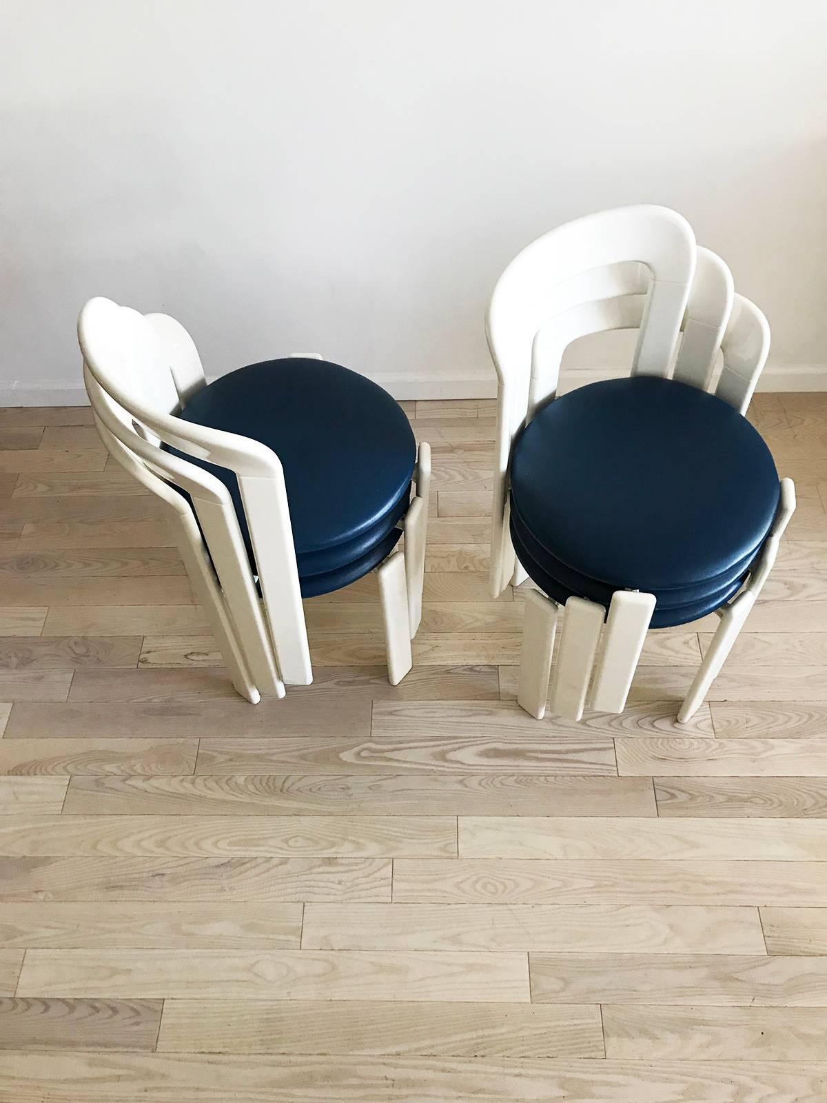 Set of six, 1970s Bruno Rey stacking chairs, from Switzerland. Shinny white laquared frames with blue vinyl padded seats in excellent condition.
   