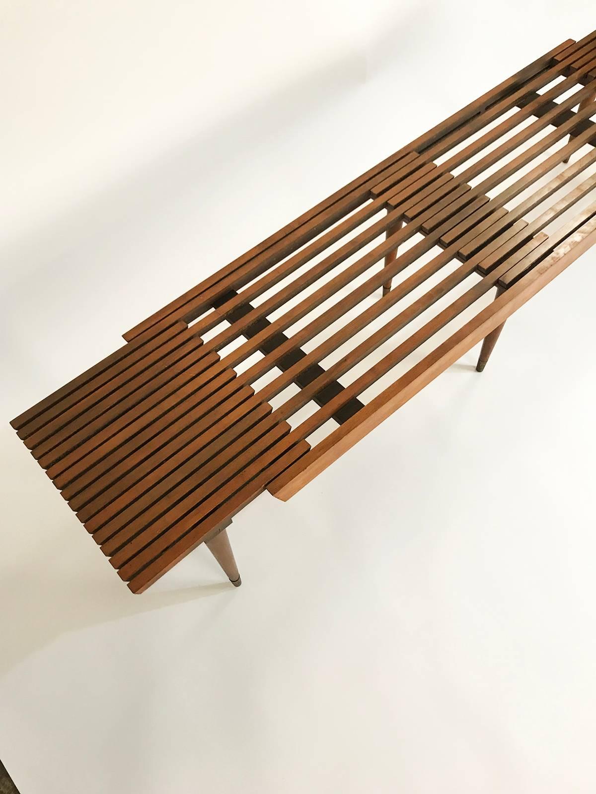 Great midcentury Scandinavian slat bench that expands in width. Grows from 52