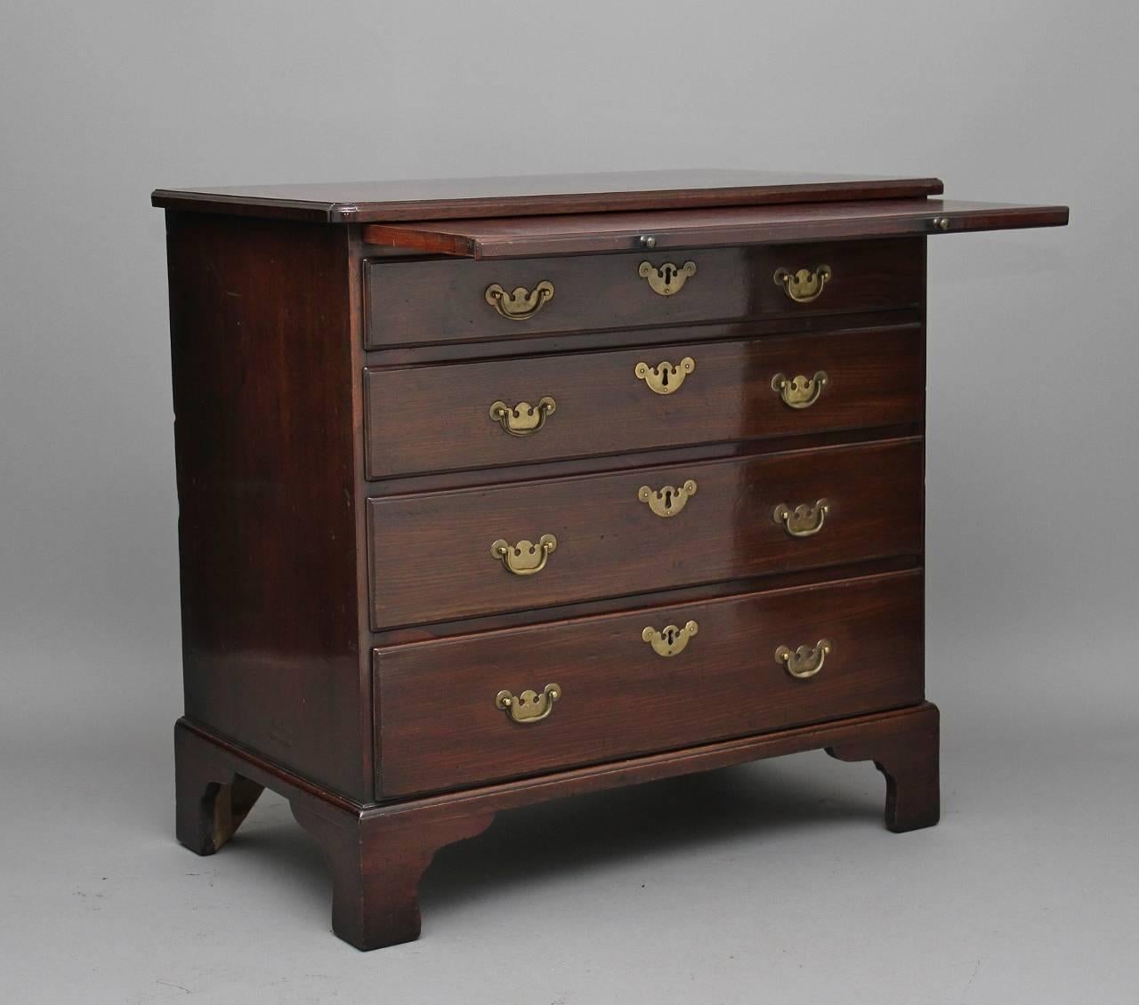 18th century mahogany chest of drawers, the rectangular top having a nice moulded edge, with a brushing slide below, four long oak lined graduated drawers with brass plate handles and escutcheons, supported on bracket feet, circa 1780.