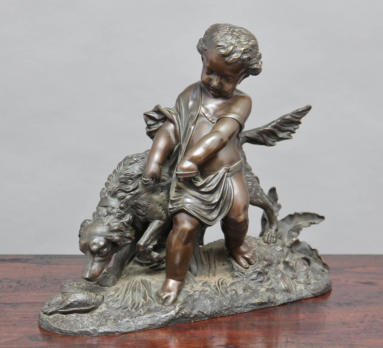 19th century, French bronze by Auguste Joseph Peiffer (1832-1886) of a young boy restraining his hunting dog, with a bronze base with plants and fowl, the bronze having a nice brown patina.
  