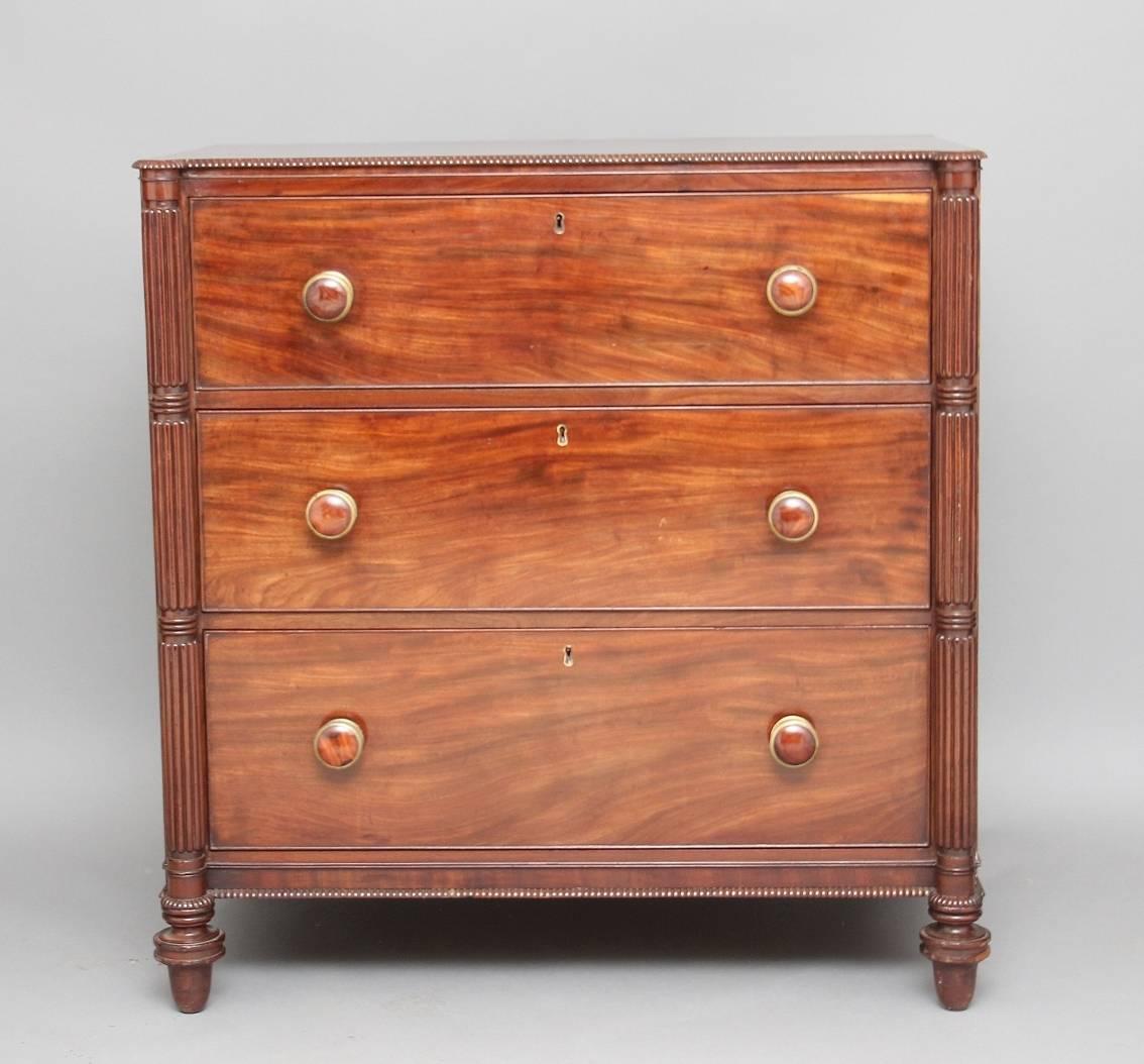 Early 19th century Regency mahogany secretaire chest, the top having a nice beading along the edge, the top drawer having a secretaire drawer with a lovely fitted interior with various drawers and compartments, with two solid lined deep drawers