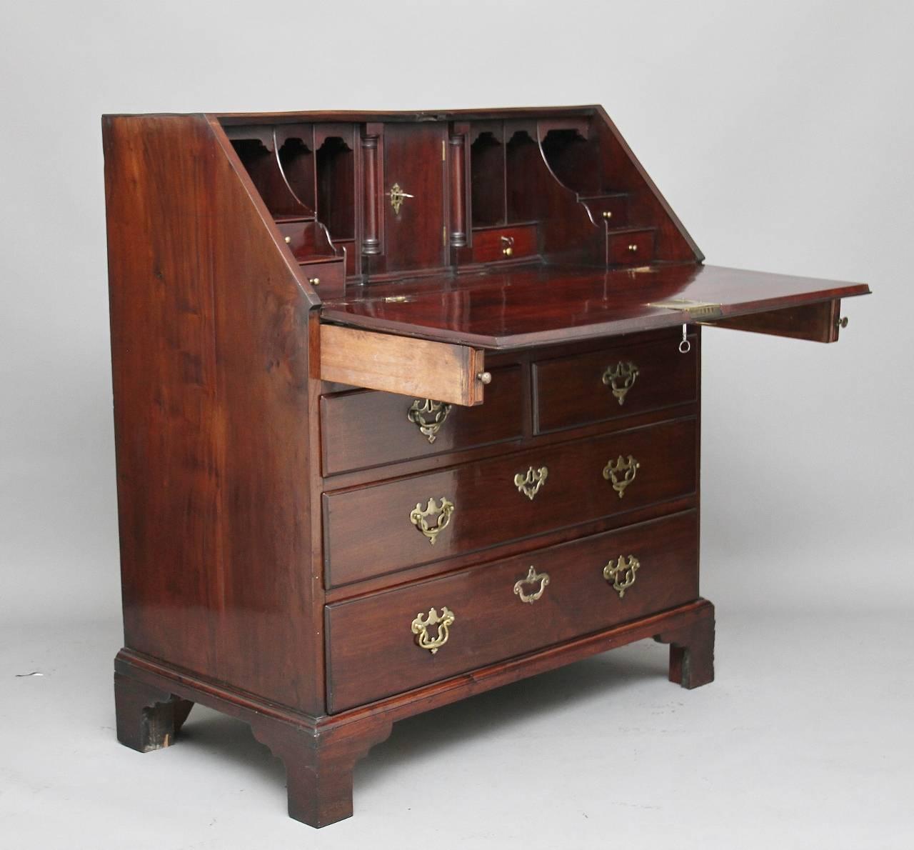 A fantastic quality 18th century Georgian mahogany bureau with a lovely fitted interior with various drawers and compartments, with a hinged door in the centre with pull out slides either side, all drawers, including the door has workable locks with