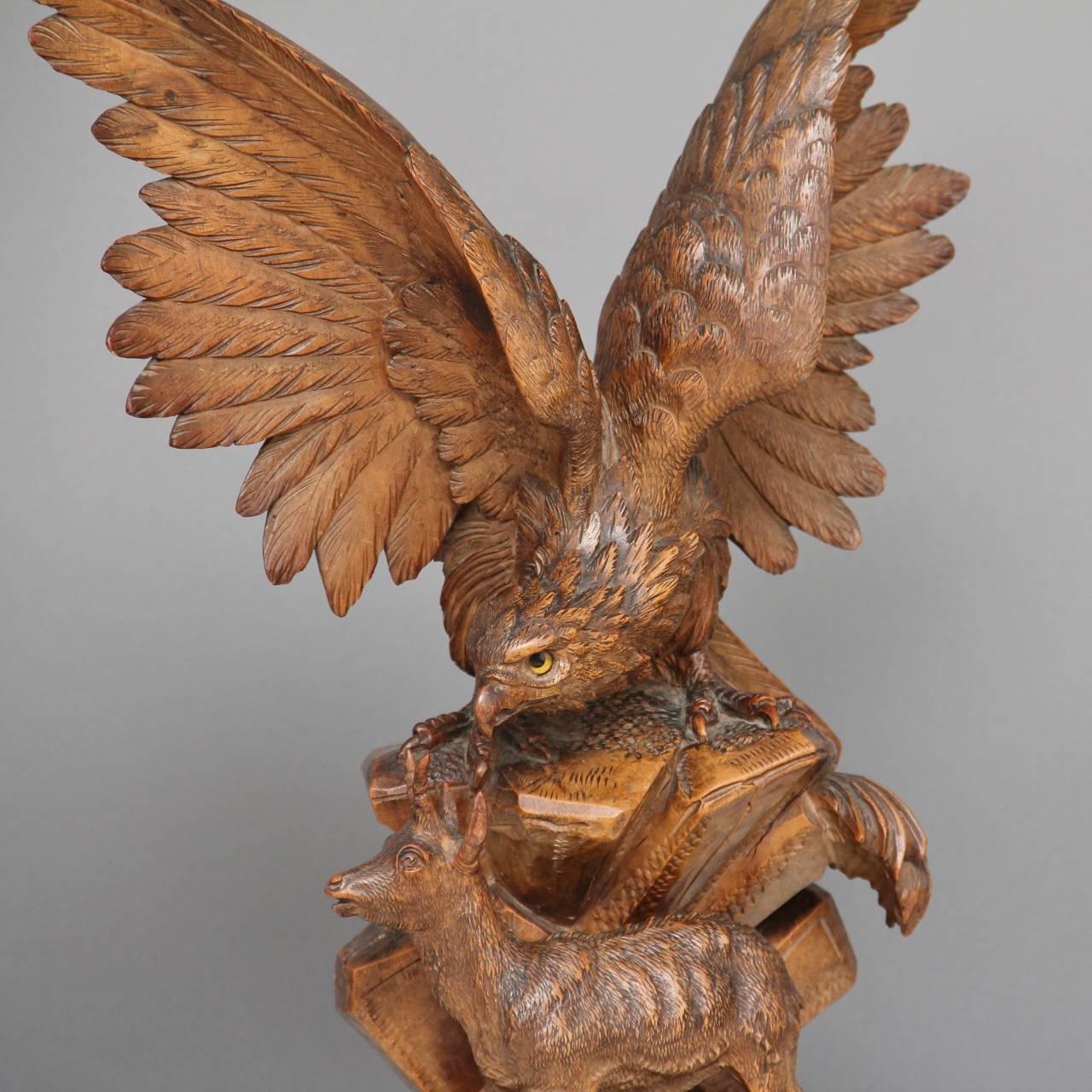 19th century walnut Black Forest carving of a eagle perched on a rock with a deer below, lovely crisp carving and fabulous quality, circa 1880.