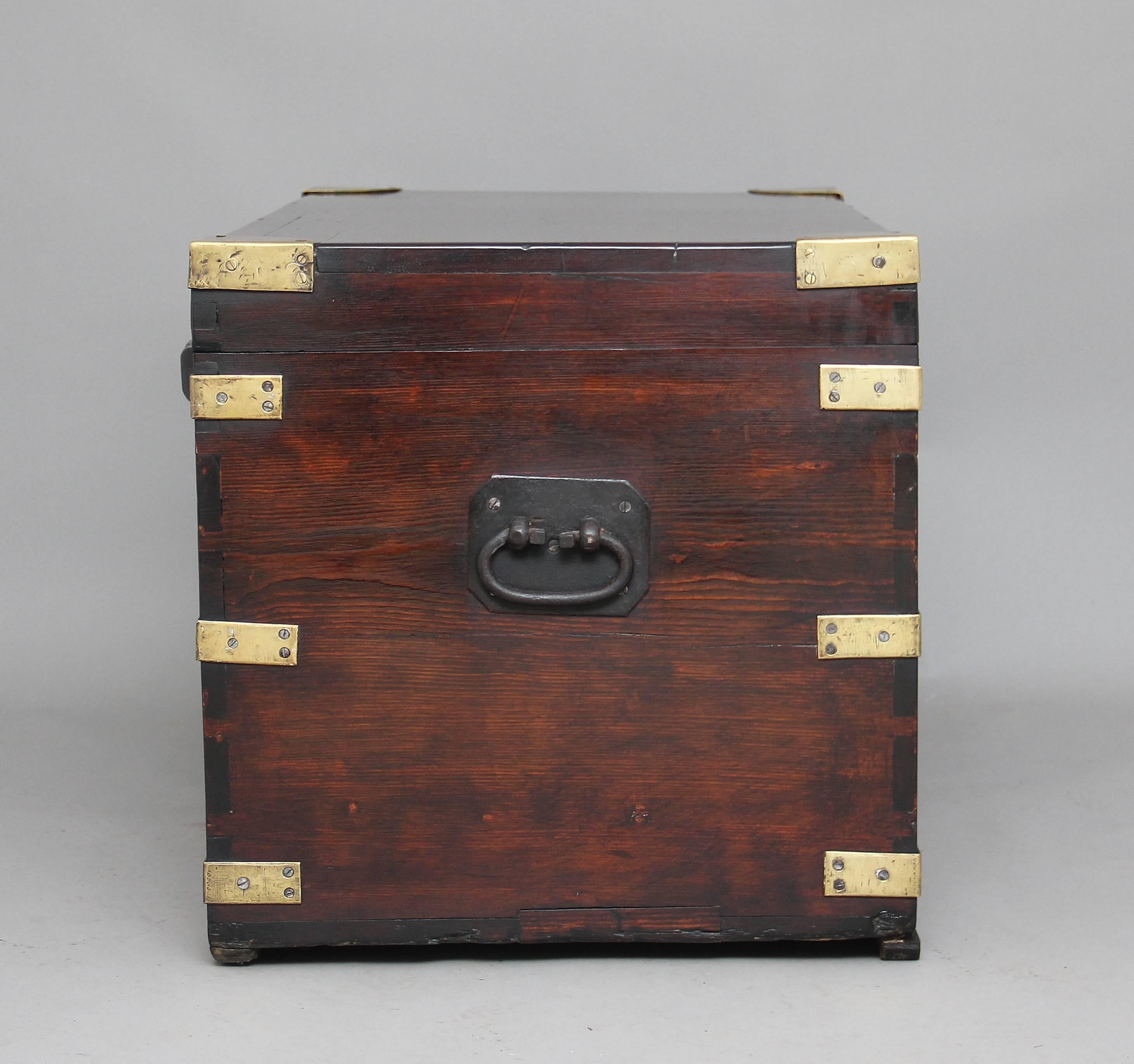 19th century mahogany and brass bound trunk, with iron carrying handles to the sides, the hinged cover opening to reveal a nice fitted interior with lift out hinged compartments and a central tray, circa 1880.
 
