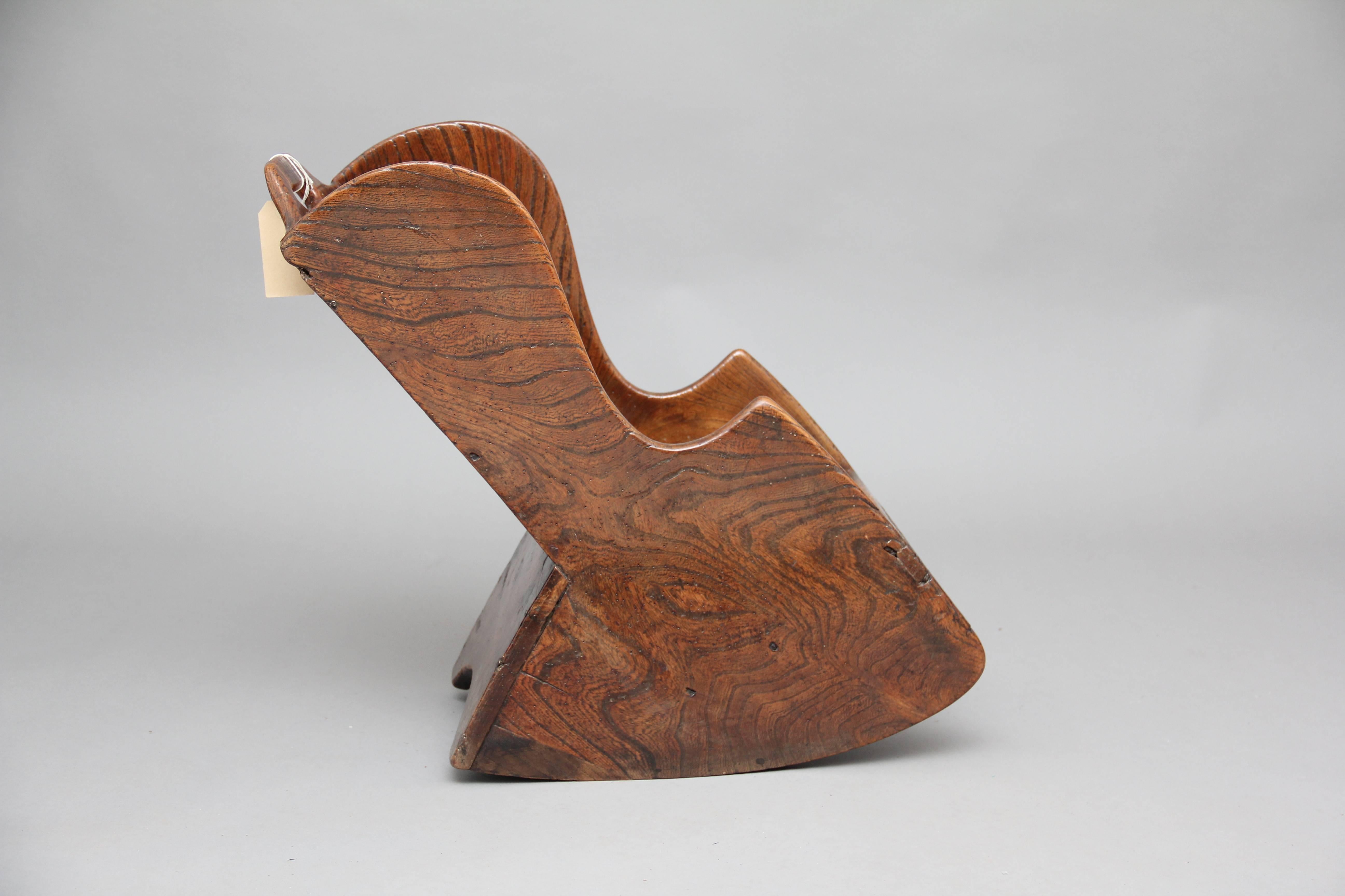 18th century elm child’s rocking chair, with the shaped sides and top rail with pierced hand holds, lovely patina, circa 1780.