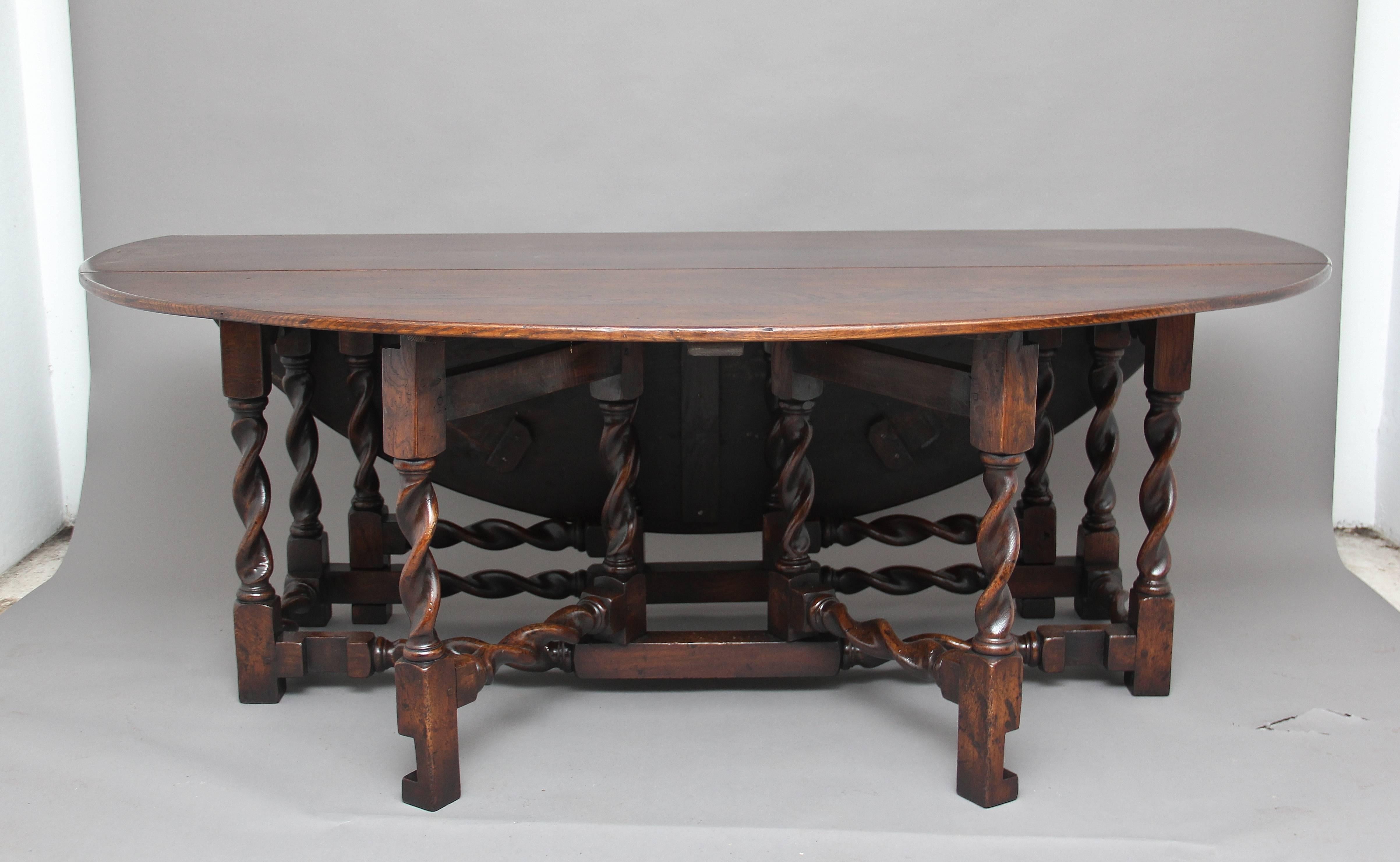 A lovely quality mid 20th Century oak double gateleg table with barley twist legs and rails, a fantastic oak colour and well distressed, this is a good copy of a late 17th Century table.  Circa 1960.