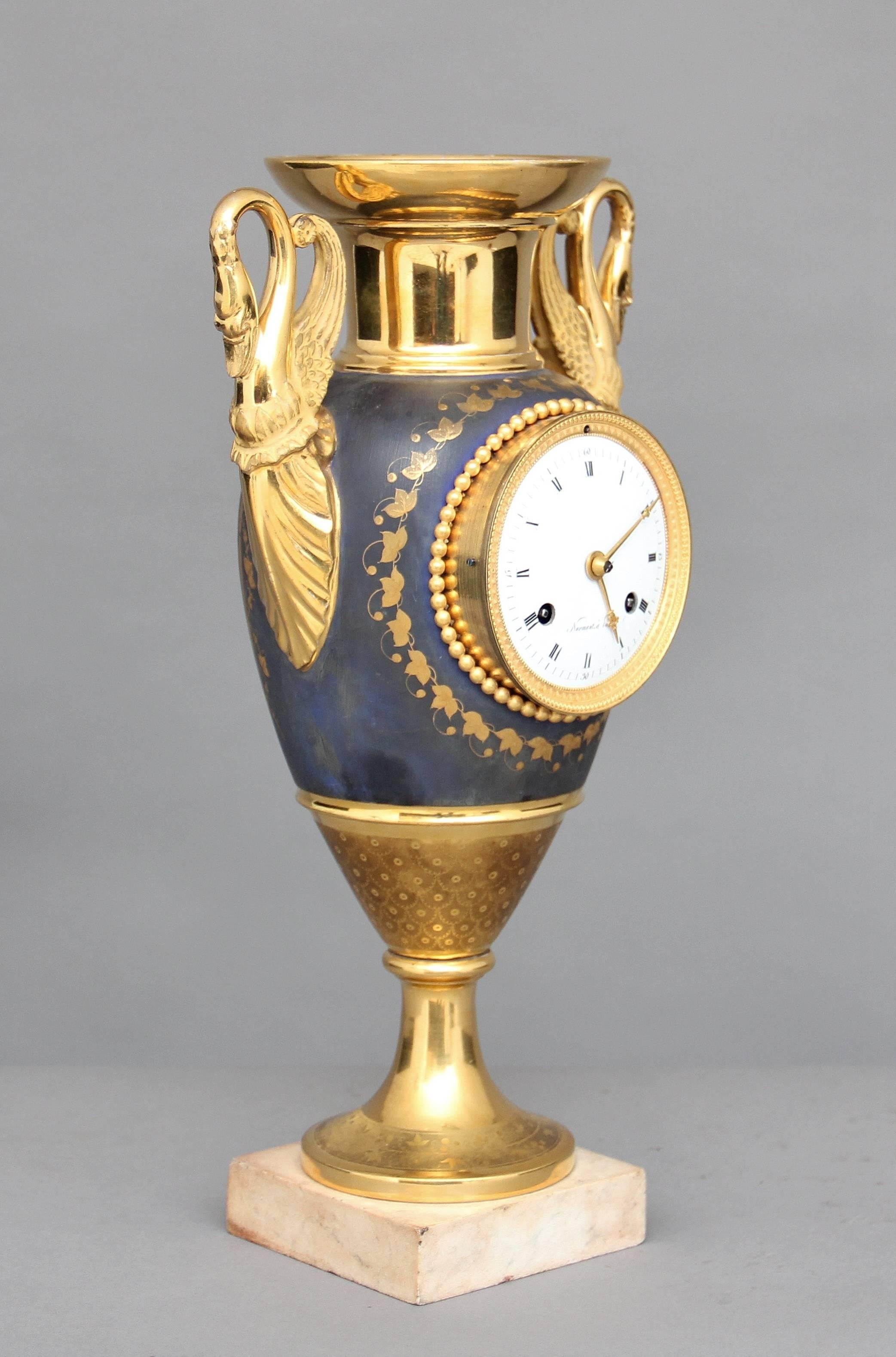 19th Century French porcelain mantle clock, the porcelain vase is blue with very fine gilt decoration and has an early 19th Century movement that strikes on the hour and half hour, this clock is in fabulous condition and keeps good time, it was more