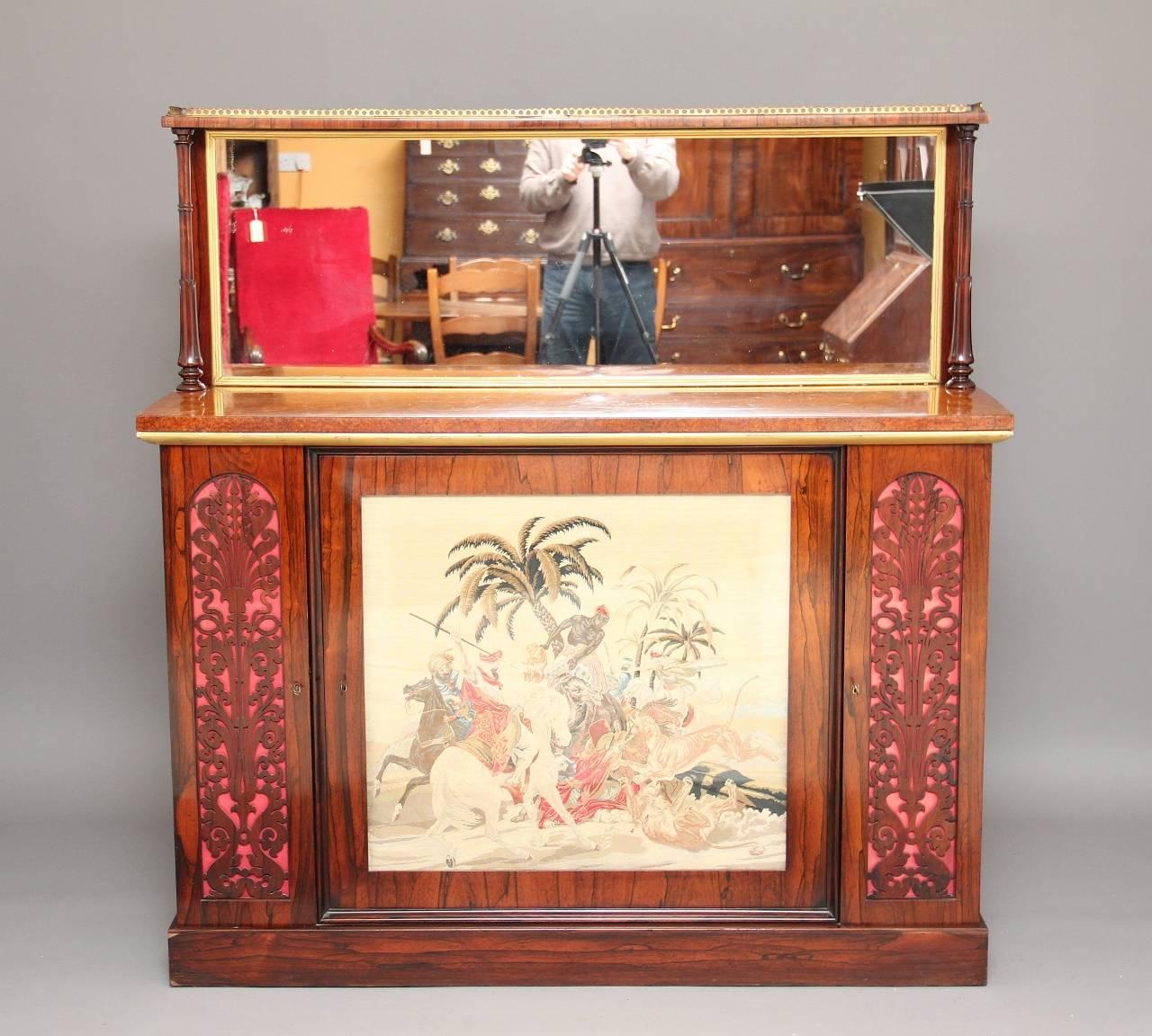 19th century rosewood cabinet with a burr walnut top, the top section with mirror back with a shelf with a brass gallery running along the top, supported on turned columns, with a burr walnut top with gilded mouldings, the cabinet section with a