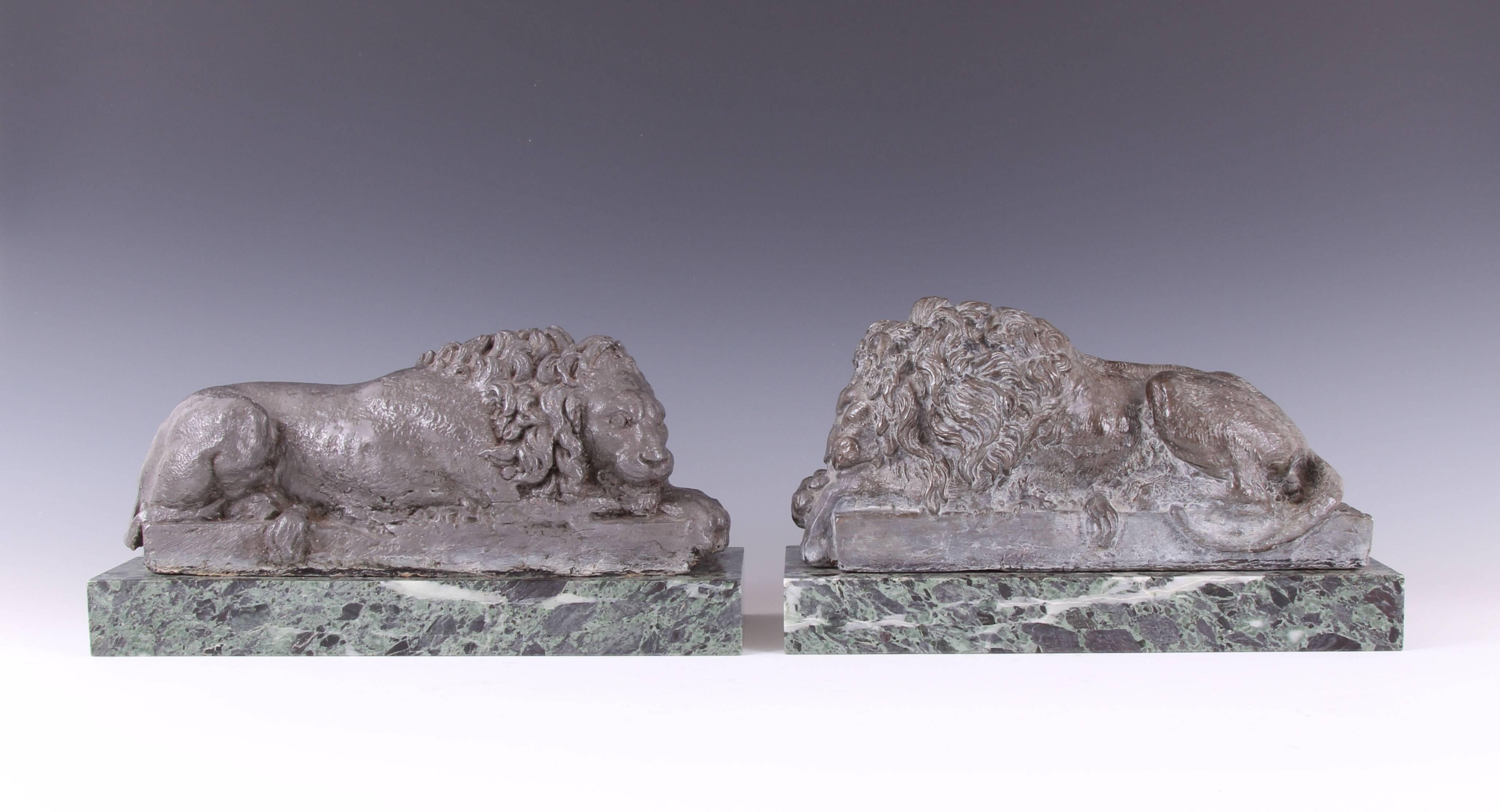 Incredibly rare pair early 19th century grand tour sculpted lead models of the canova lions on verde antico marble plinths. The rarity of these two pieces, modeled after the originals carved in marble by Antonio canova, cannot be overstated, you