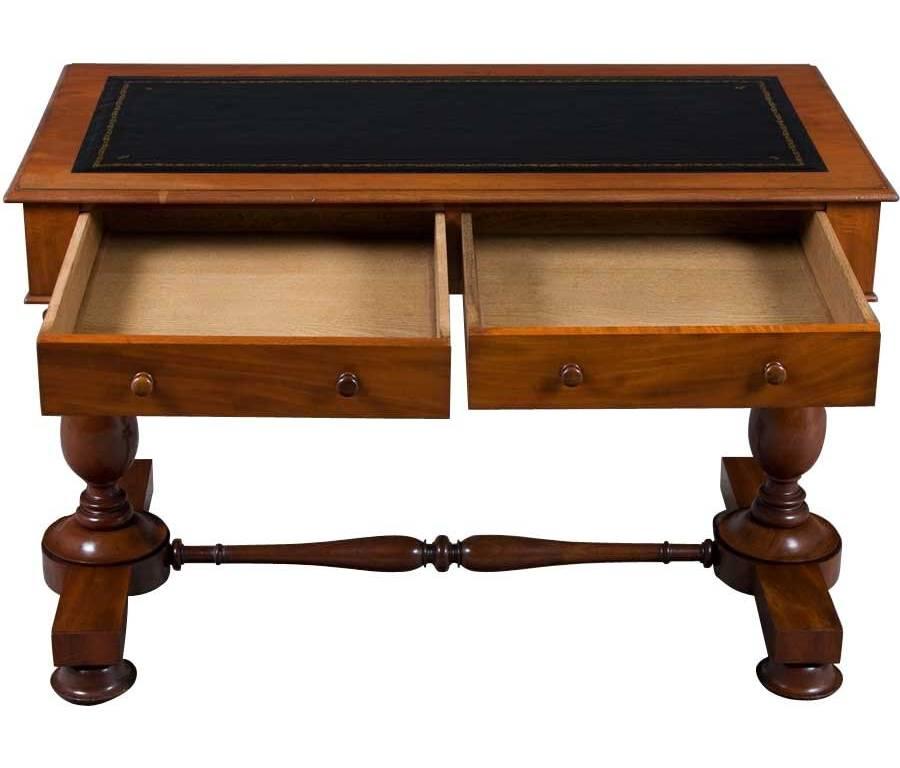 The Victorian period of furniture making in England extended from 1837-1901 and created some lovely furniture pieces such as this antique Victorian writing desk. Made from a lovely mahogany wood and covered with a fine, green leather writing