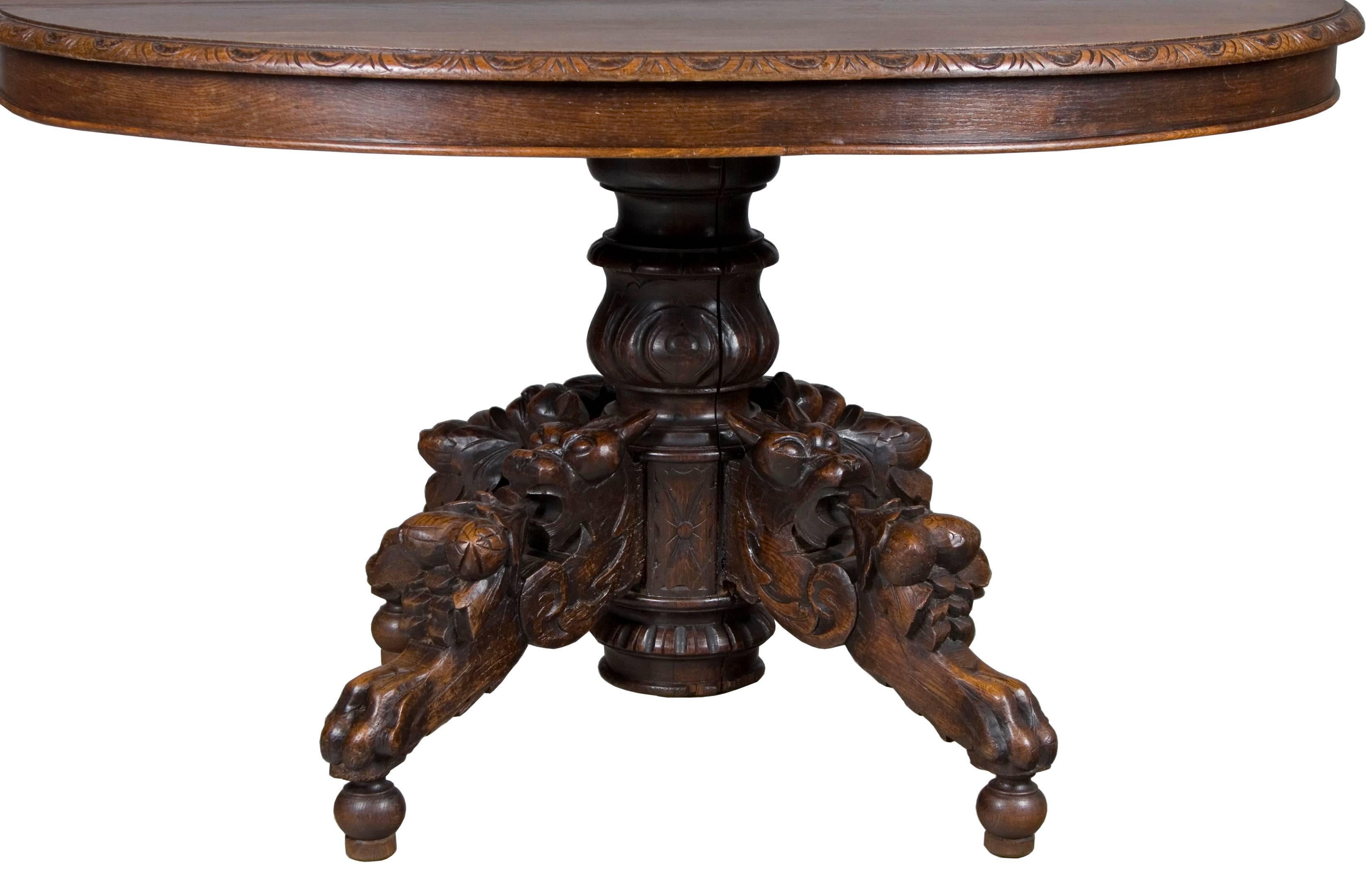 Originally made in France, circa 1890, this oak fox head dining table is a stunning piece of furniture. The obvious main feature of the table are the hand-carved fox head legs, however, the carved edge and beautiful wood also provide a charming