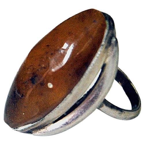 Lovely and large Silver ring with a big beautiful oval amber stone covering the top. Nice and elegant silverbase. Scandinavian. fro around the 1950-60s. Modernism.
Inner diameter is 16 mm, height of ring 25 mm. Size of stone 13 mmW and 39 mmL.
