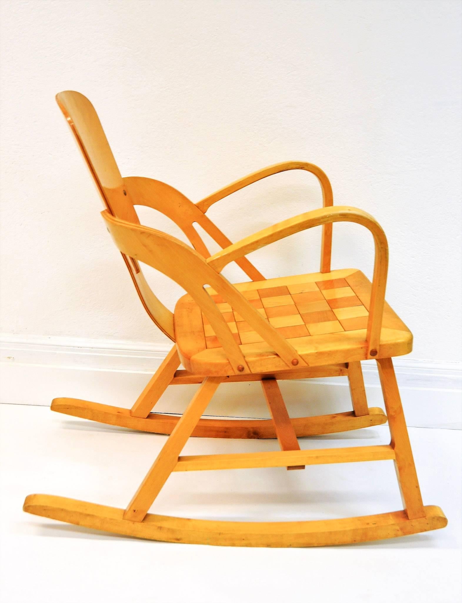 The popular Per Aaslid Rocking chair. With beautiful chesspatterns on the seat. Designed and produced by Per Aaslid (1937-1972). Aaslid Møbelfabrikk 1940/50`s. Seatheight: 38 cmH, seatwidth: 42 cm. The rockingchair is also called the