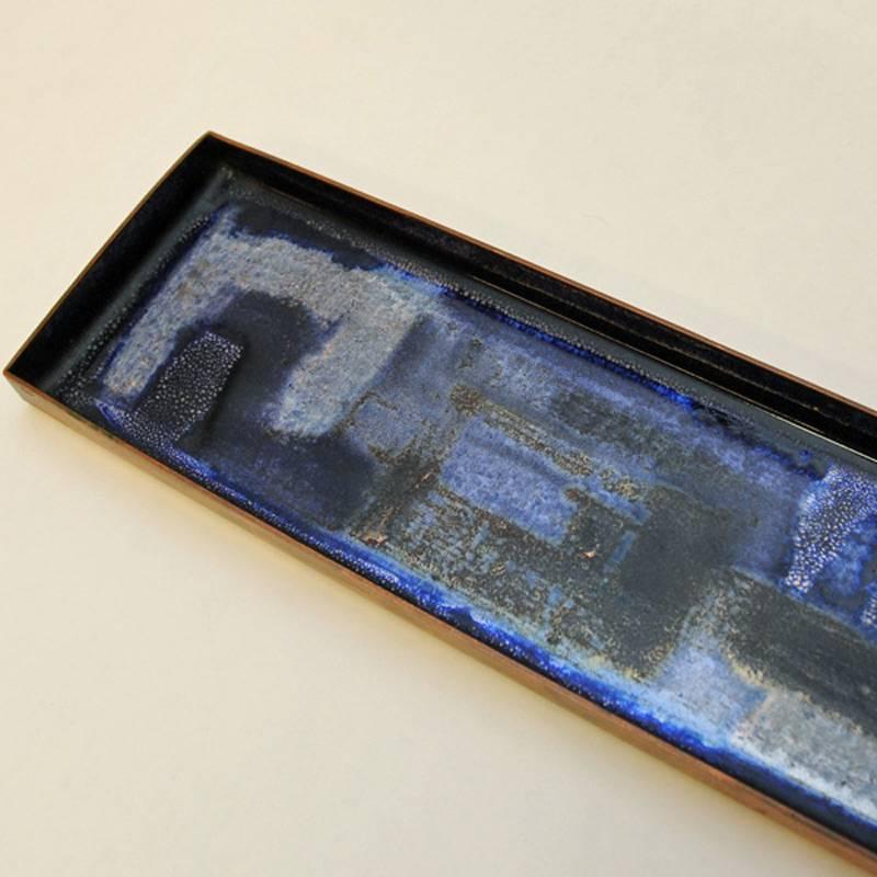 Rectangular coppertray designed and made by Bjørn Engø (1920-1981) with beautiful blue colored enamel and different shades. From Bjørn Engø's own workshop, 1960s. Size: 41.5 x12 cm.
Bjørn Engø (born 1920 in Oslo, died 1981) was a Norwegian interior