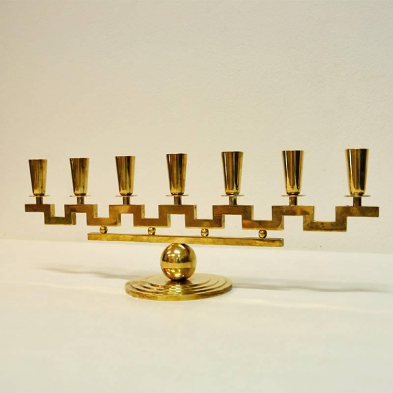 Rare end heavy candlestick holder with seven arms for candles. Special geometric shape and design. Signed and labeled by Lars Holmström, Arvika. Dates from 1950s. Measures: 50 cm L, 17 cm H and 15cm D of the base/foot.
Lars August Holmström was