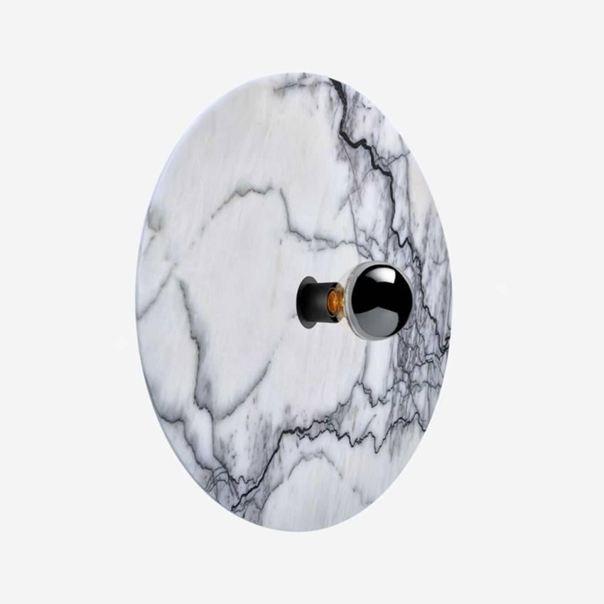 White marble with black veins piece mounted on a black lacquered metal base.
Can be used as a wall or ceiling light.
Handmade in Europe.
 