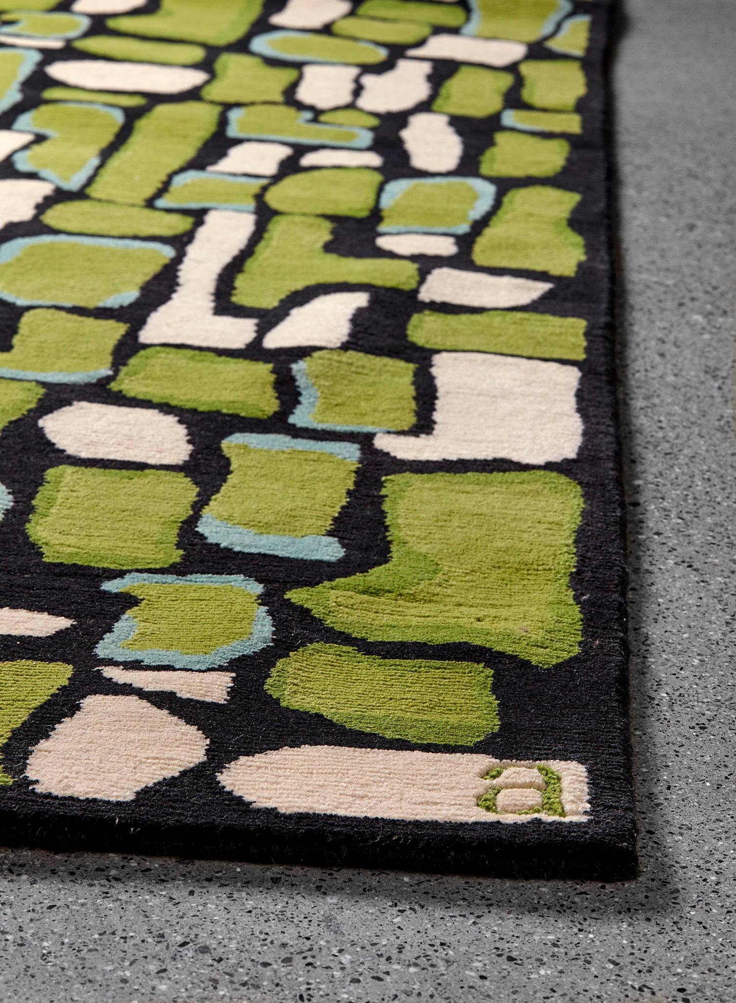 Composites of the simplest elements make up some of the greatest wonders of the natural world. The Pyrite / Emerald area rug from Angela Adams combines simple, colorful, organic shapes in black, green and turquoise to create a textural landscape.