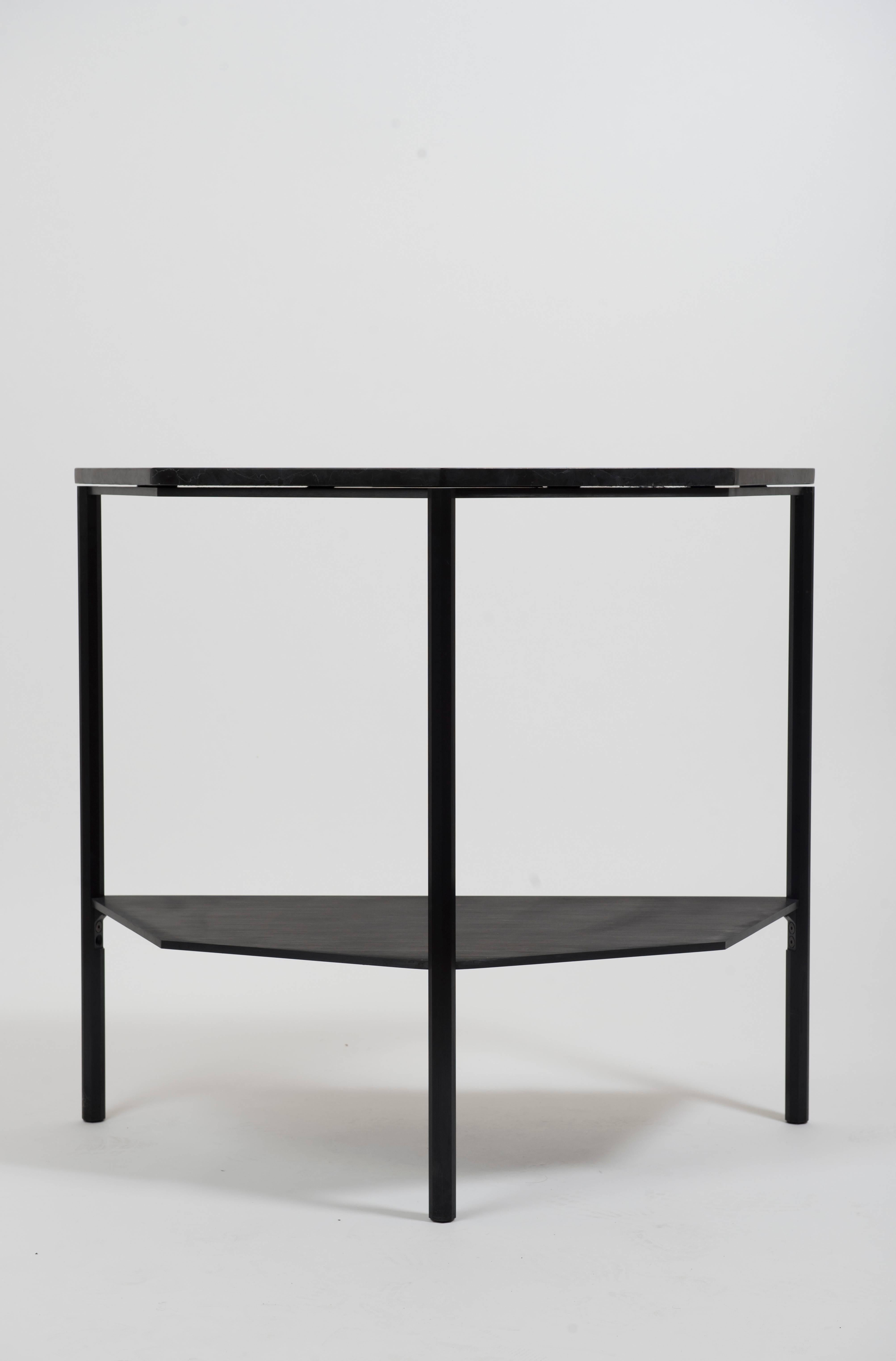 This half-octagon shaped console is a contemporary take on the demilune entry console. Octagon-shaped legs are cnc-milled out of square aluminium solid bar, and hand brushed and anodized in satin black. Legs are connected via custom milled aluminium