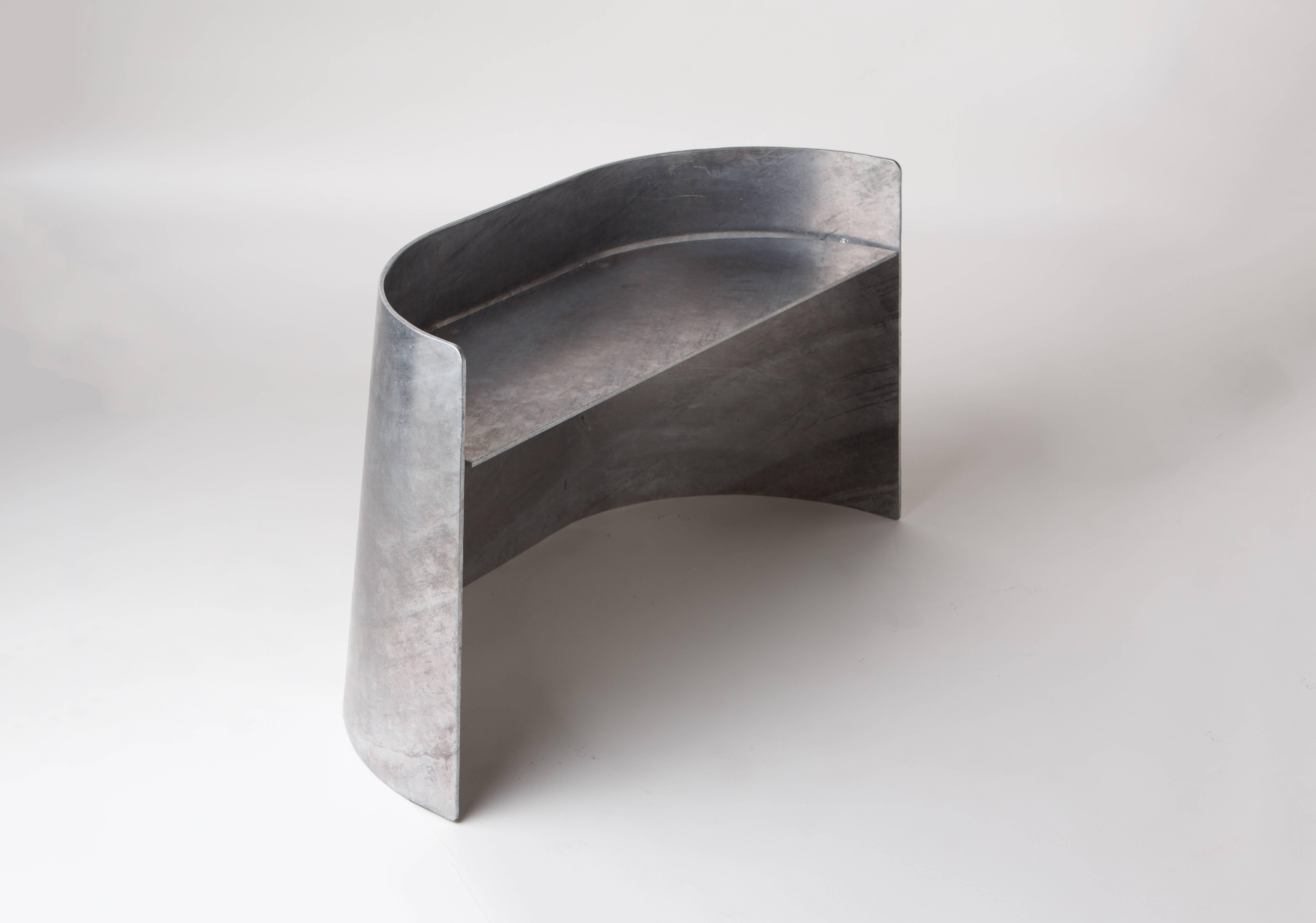 The Sentry bench, originally commissioned by New York interior designer Charlie Ferrer, makes a perfect entryway sculptural seat. Made of laser-cut and hand-rolled .25 inch thick steel with floating welded seat perch. The finish is produced by