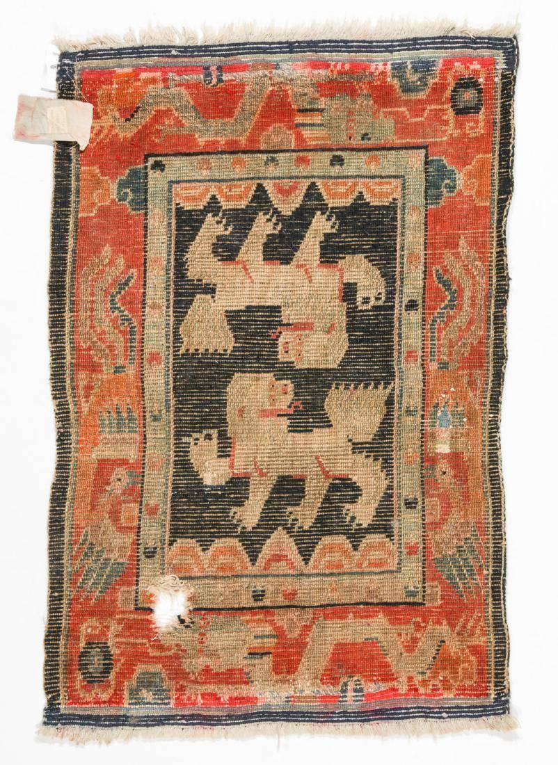 Antique Tibetan double snow lion rug.

Measures: 1'10