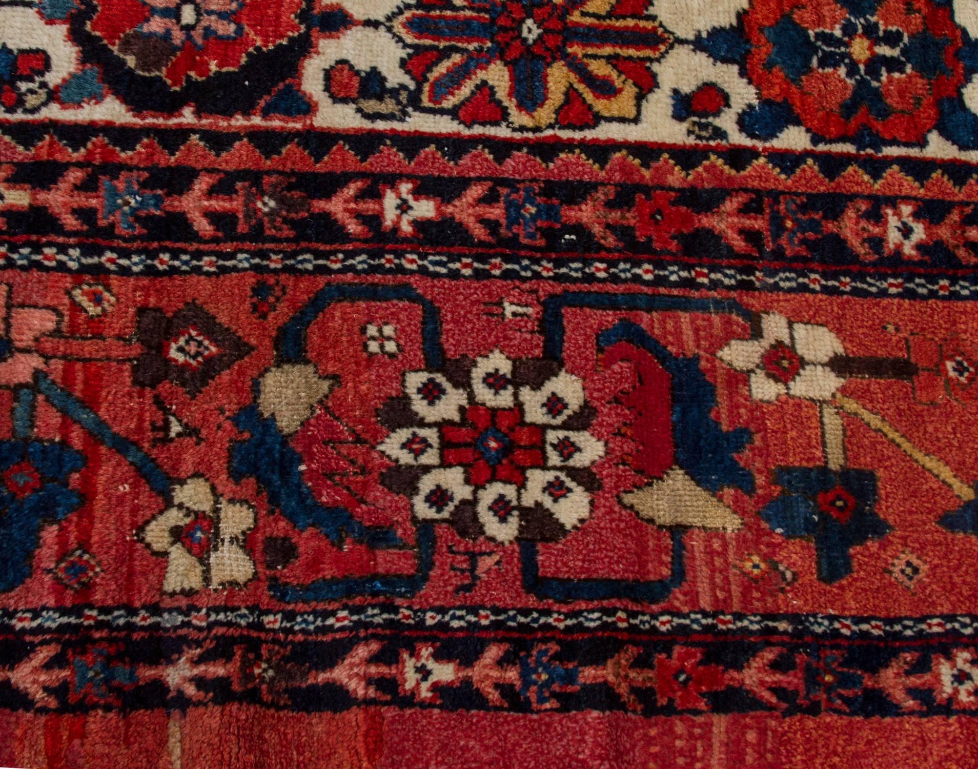 This is a spectacular wool rug. Once owned by Hugh Hudson, it is an incredible example of Mina Khani design on a Mahal Rug. 
The floral design on a white field is surrounded by a crimson floral style border. 
Mina Khani design is known for its