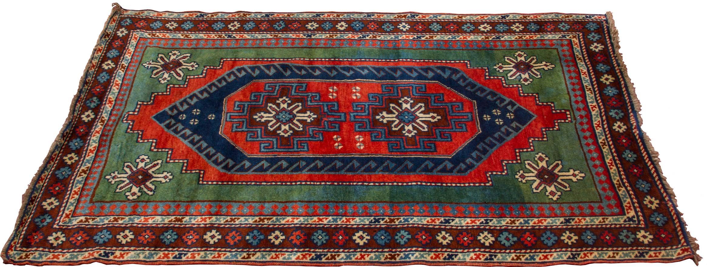 Made during the 5 Year Plan when rugs were made to resemble the rugs woven in  the Caucuses.  
This was during the First 5 Year Plan in Russia, when there was a large push towards industrialization. 
This rug was originally created in the Caucuses