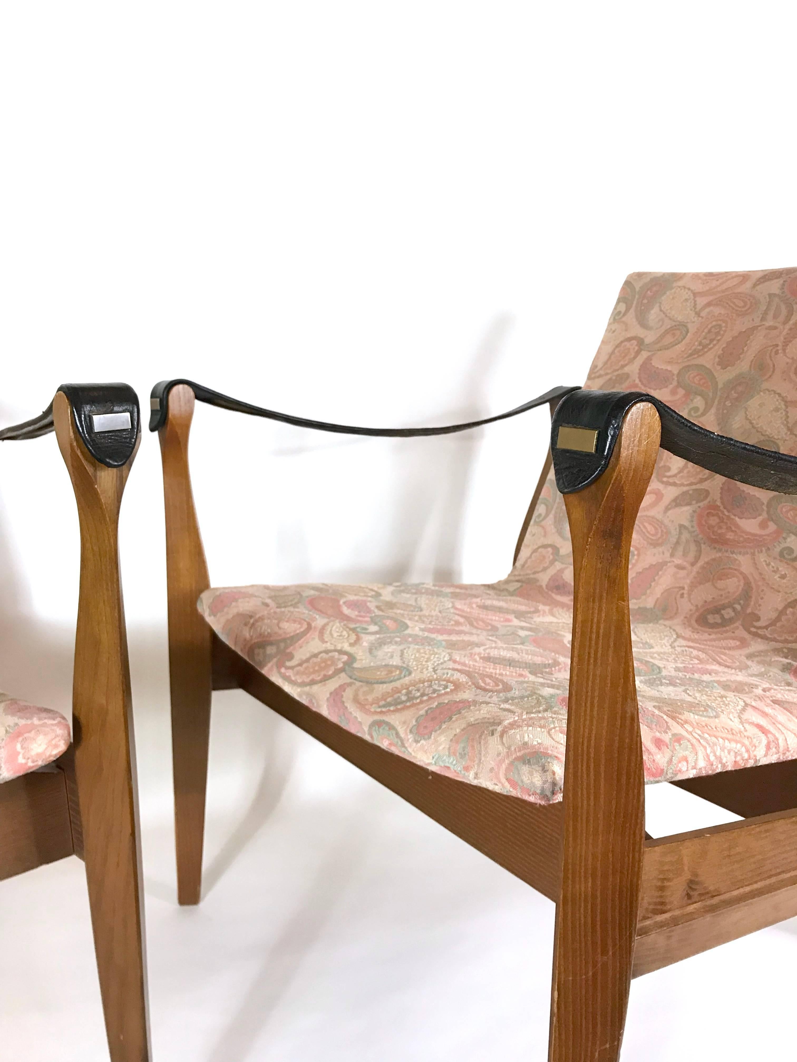 Pair of rare lounge chairs designed by Karen & Ebbe Clemmensen (Safaristol, Safari stool) for Fritz Hansen / 1958, Denmark. The frame of the armchairs are made of ashwood, seats covered with fabric and arm straps made of leather. Signed with
