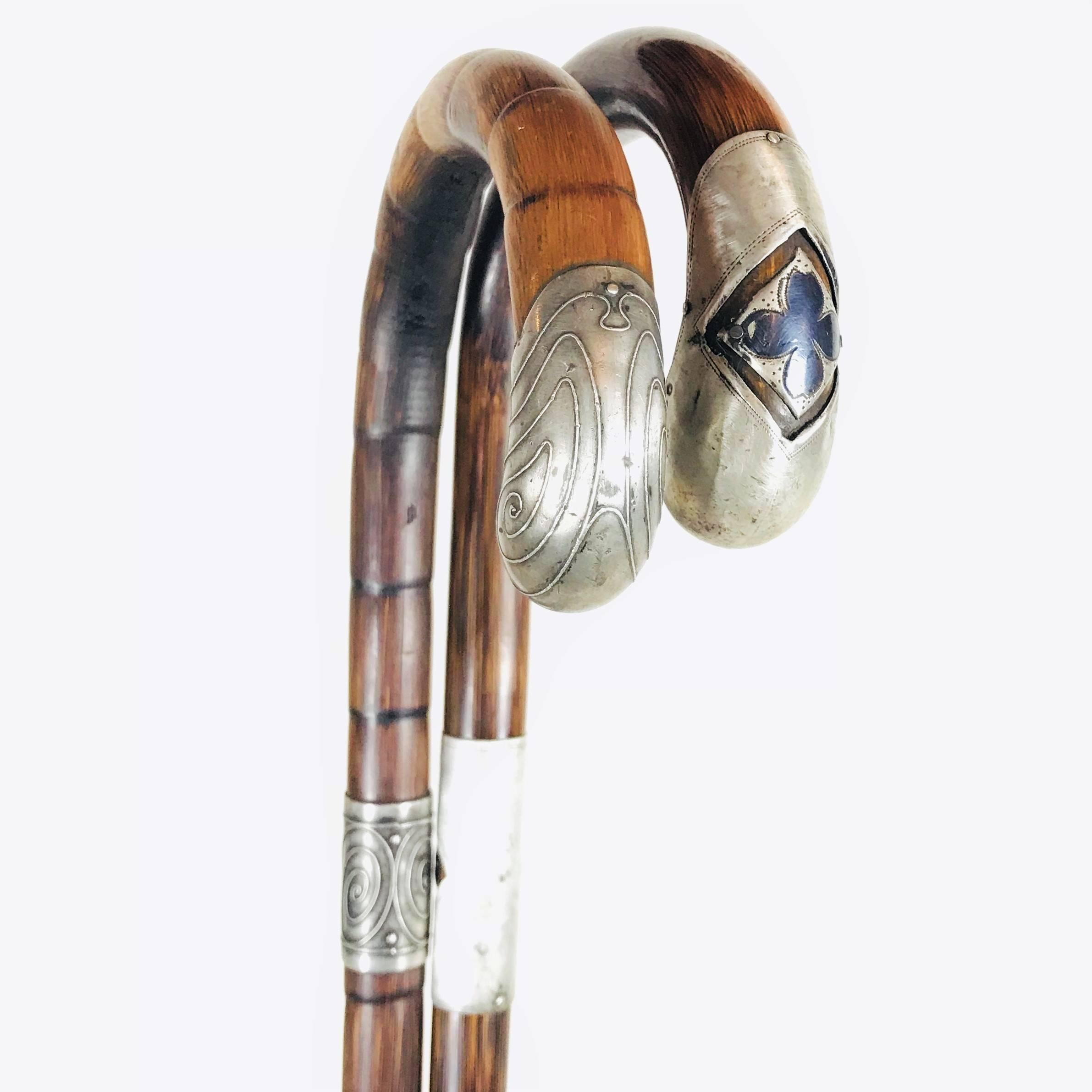 Wonderful silver handled walking canes, creations of Viennese jewelers of the early 20th century in the period of Wiener Werkstaette.
The first stick is made of Fine peacock wood, terminating in a hallmarked silver handle fashioned as Art Nouveau