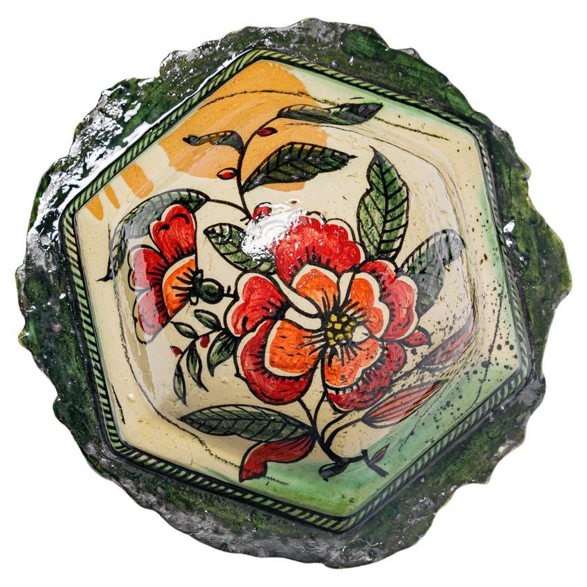 Glazed earthenware medaillon, with fantastical animals by Jérôme Galvin.