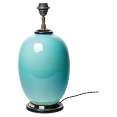 Blue glazed ceramic table lamp by Raoul Lachenal, circa 1940-1950.