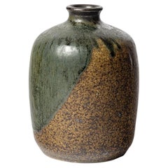 Brown and green glazed stoneware vase by Lucien Arnaud, circa 1920-1930.