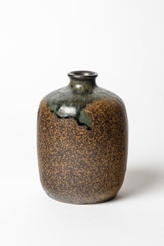 Brown and green glazed stoneware vase by Lucien Arnaud, circa 1920-1930.