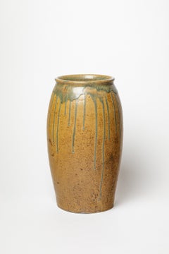 Brown and green glazed stoneware vase by Lucien Arnaud, 1920-1930.