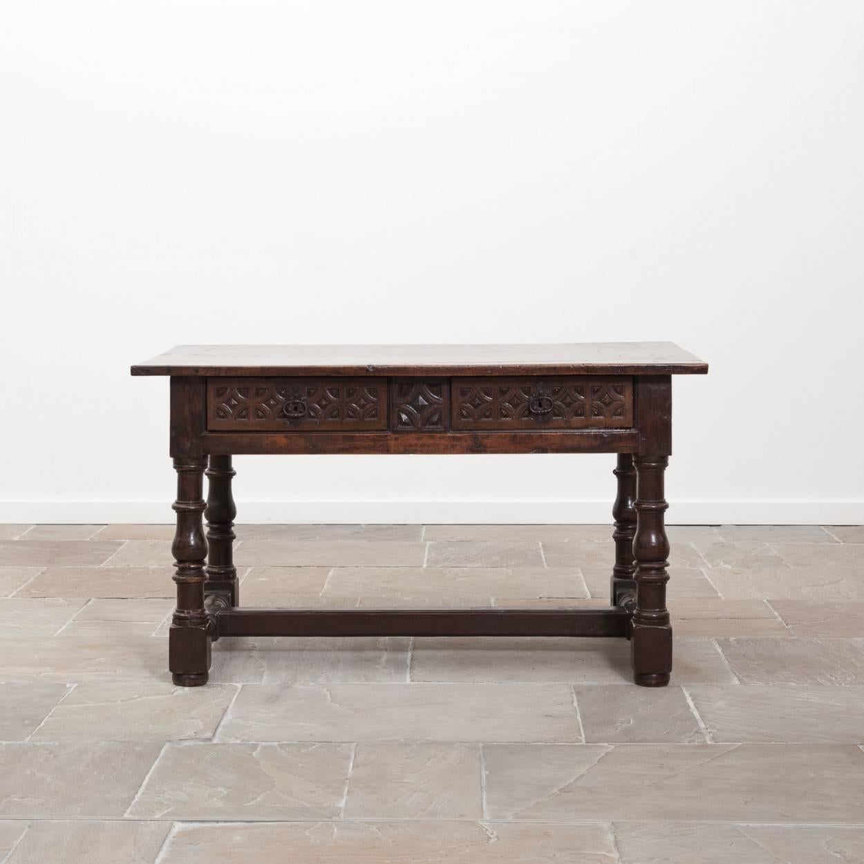 Very handsome 17th century walnut table which has a stunning top with a rich color and patination. This would make an excellent side or deep console table.

We believe the legs and stretcher have been replaced at some point in the tables history,
