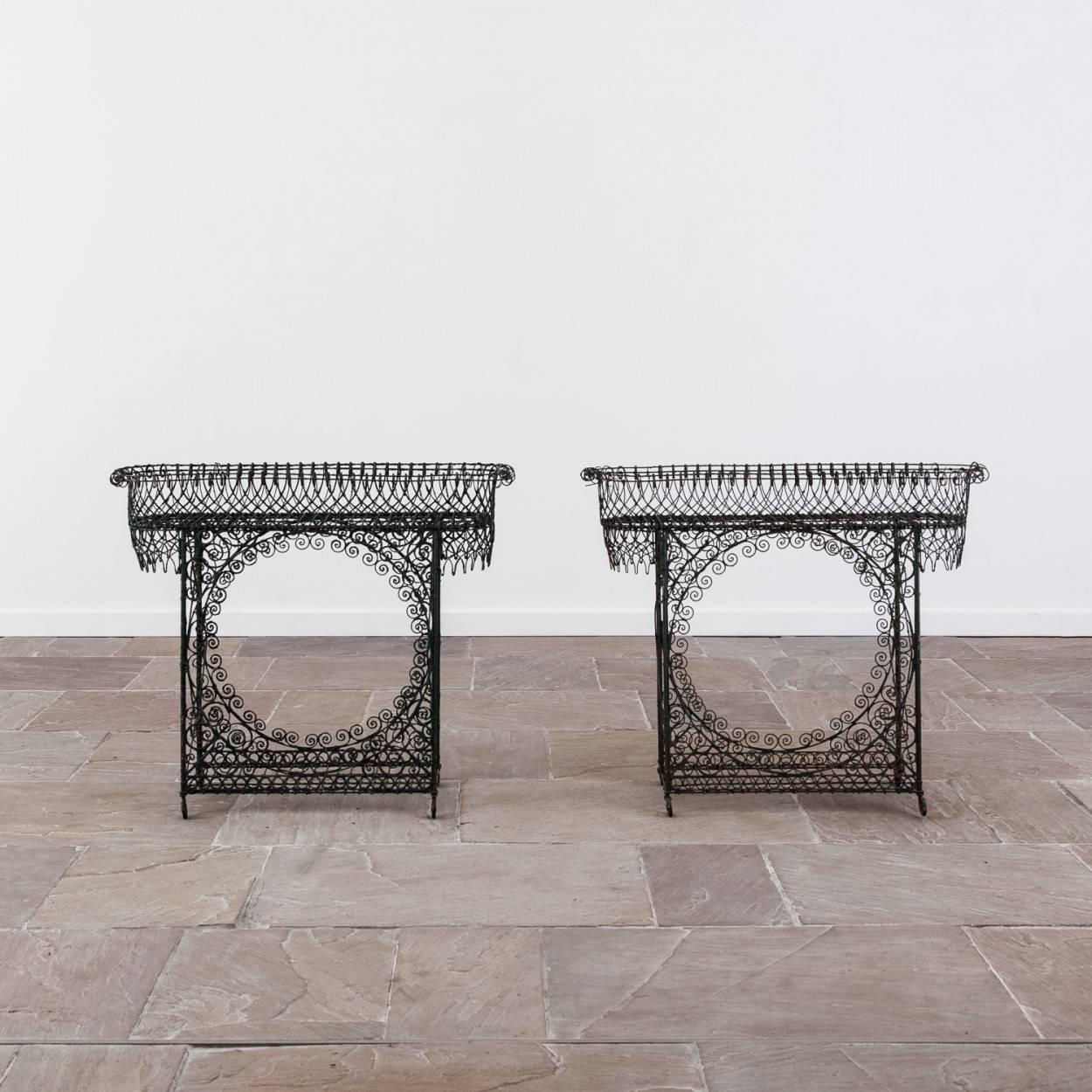 Very pretty pair of painted 19th century wirework plant stands.

They are generally in good condition, one of the plant stands has a couple of broken sections of wirework - see images.

Each measures approximately 85cm high, 102cm wide and 31cm