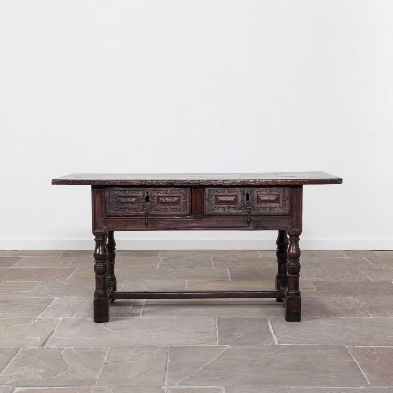 Very handsome and good looking 17th century Spanish serving table. It is a walnut table with chestnut top. 

This is a lovely original table, the only alteration being its stretcher which appears to be a historic replacement.