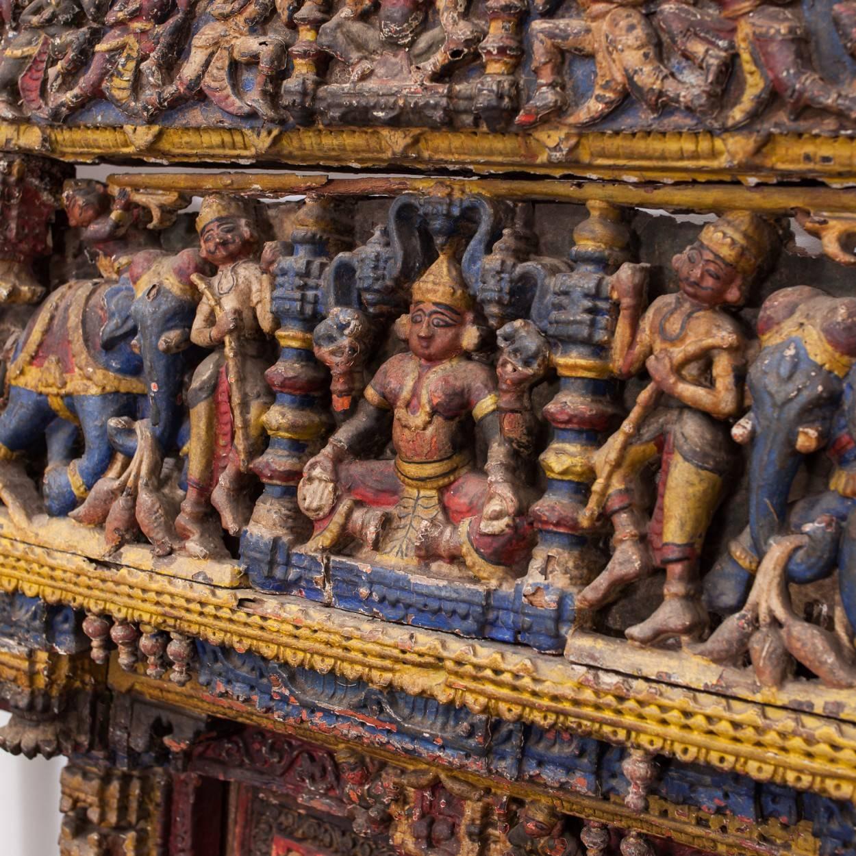 This is an outstanding highly carved and painted shrine cover from Ahmedabad in Gujarat, North West India. It belongs to the Jain Faith. 

It is carved in teak and painted in natural pigments, it is a rare survivor making it an important piece.

It