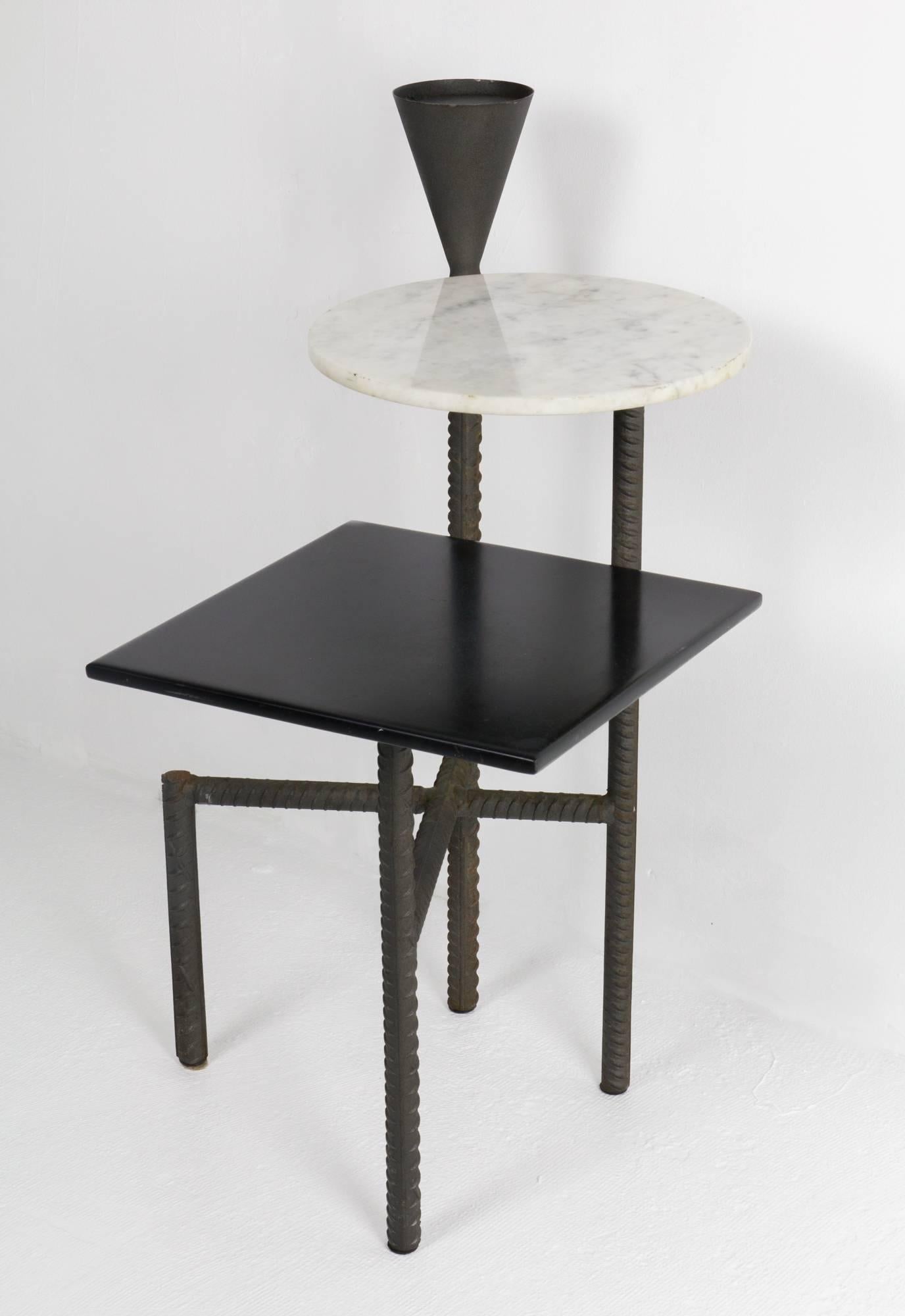 Limited-production Philippe Starck bedside table custom built for his Paramount Hotel interior having tiered Carrara marble surfaces, conical steel drink stand and rebar frame.
