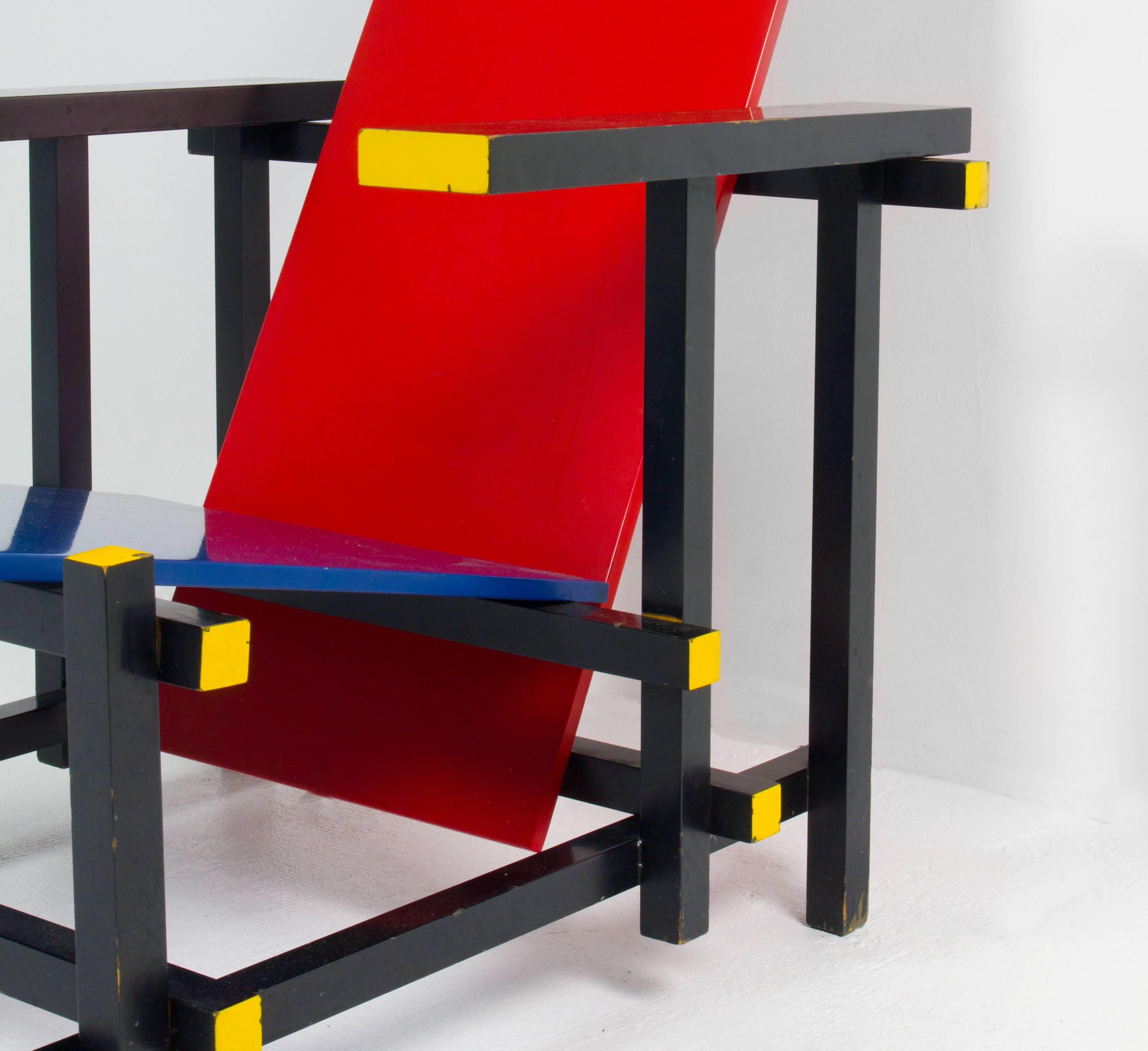 Early Cassina production of the red and blue chair (Model 635), an important De Stijl design by Gerrit Rietveld, comprised of painted beech and plywood.