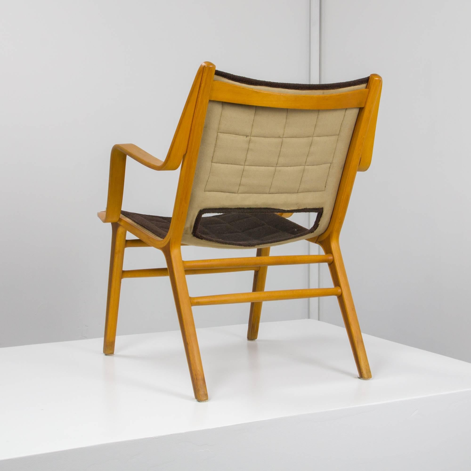 AX lounge chair by Peter Hvidt and Orla Mølgaard Nielsen for Fritz Hansen in bent beech with teak trim inlay and quilted sling seat.