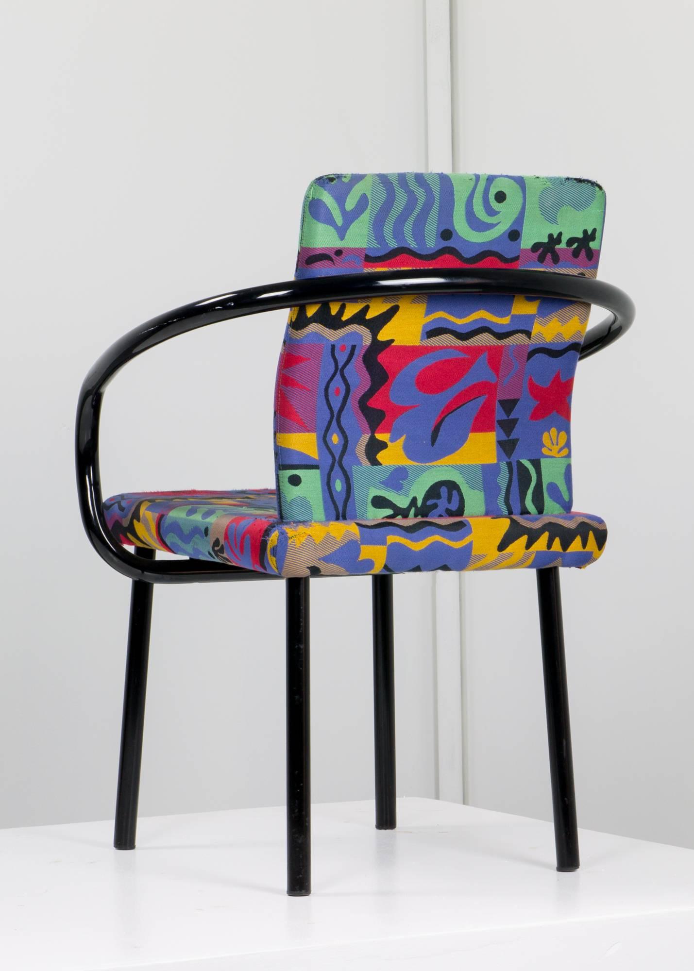 Pair of Mandarin chairs by Ettore Sottsass for Knoll in vibrant original Matisse-esque fabric with sinuous enameled steel frames nodding to traditional Chinese yoke-back chairs. 