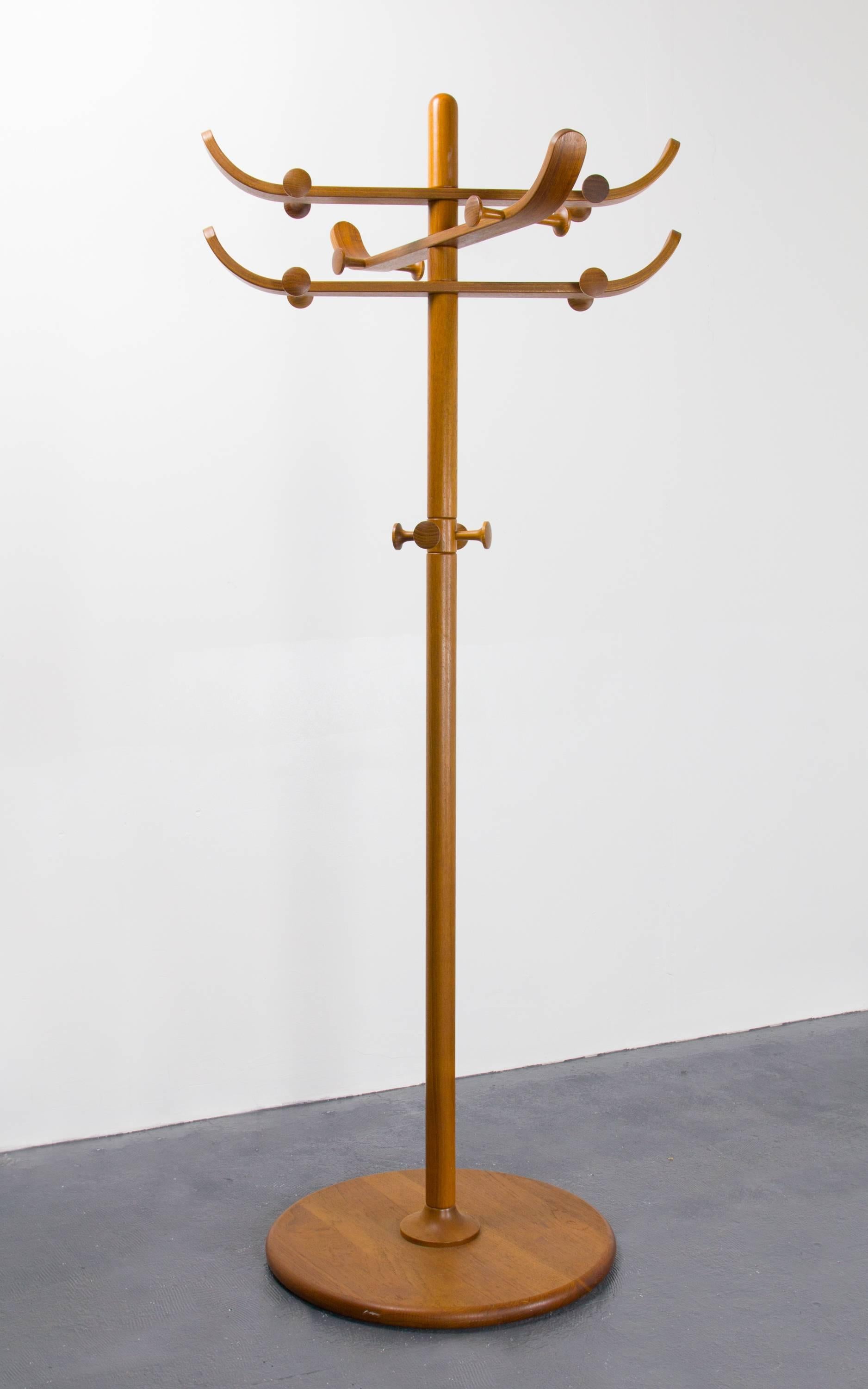 Multi-functional coat rack by Aksel Kjersgaard in teak with three rotating arms and 16 hanging knobs. Stamped on underside.
