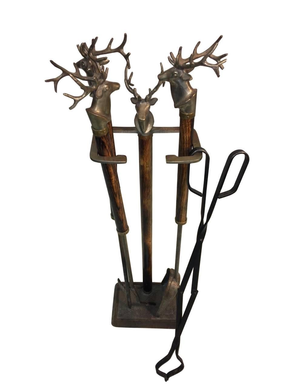 Cast Elk heads in bronze with Ash handles consist of four tools poker and scissor tongs and shovel,
circa 1940 Adirondack style.
 